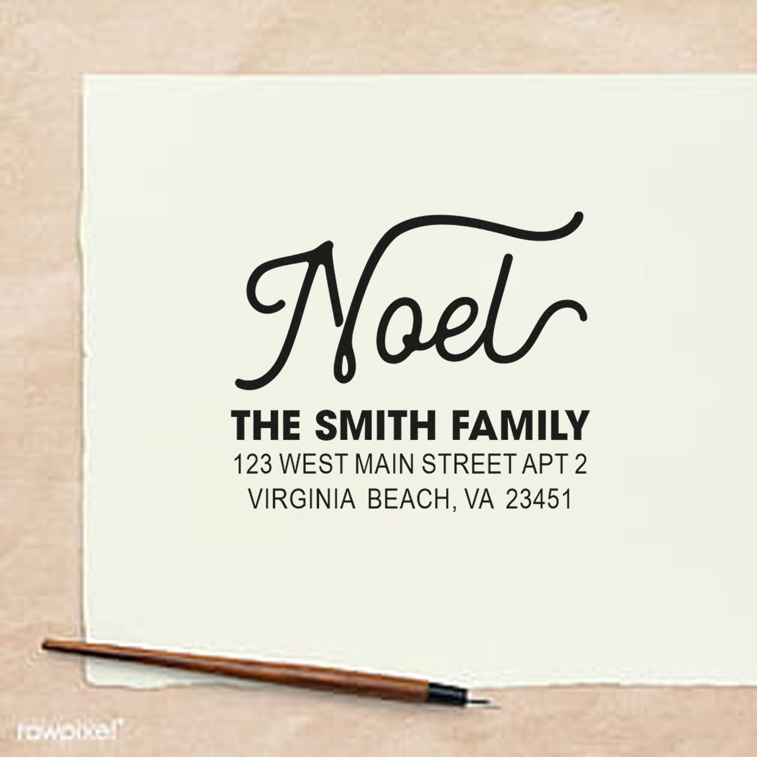 Custom return address rubber stamp for The Smith Family with Noel name and Virginia Beach, VA address.