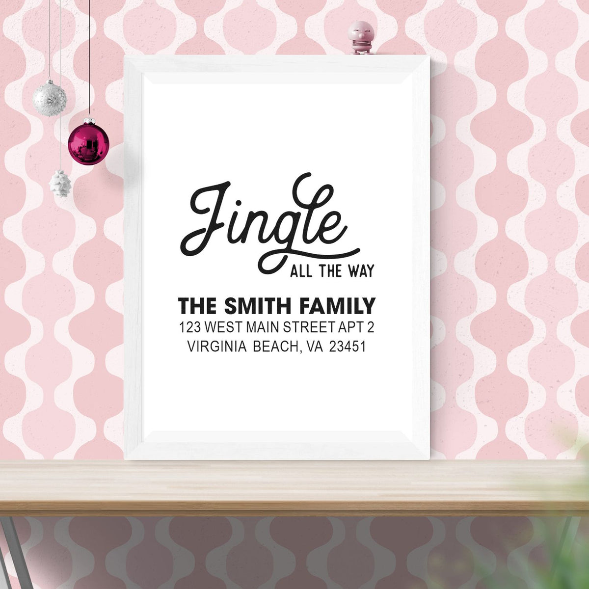 Custom holiday address rubber stamp design with Jingle All the Way, family name, and Virginia Beach address on framed mockup