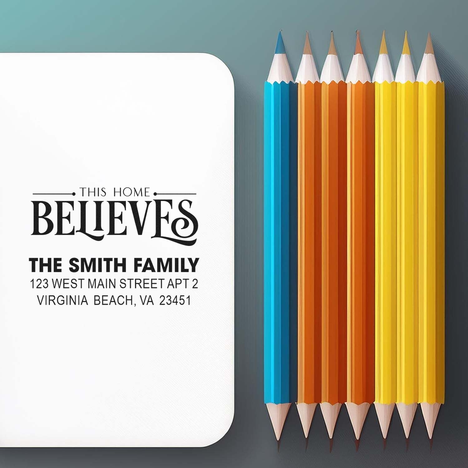 Custom rubber stamp design with This Home Believes family address imprint for personalized home stationery.