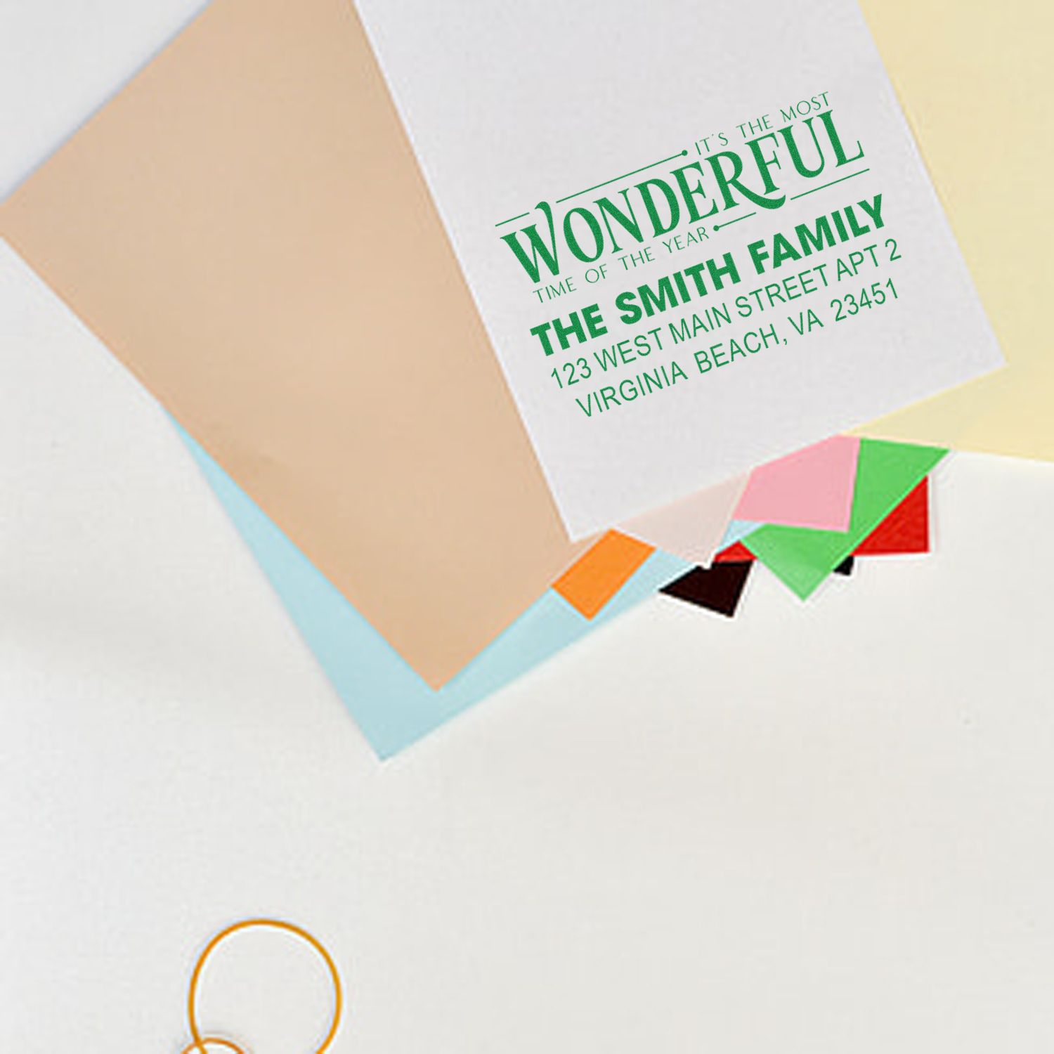 Custom Christmas address rubber stamp on envelopes, featuring Its the Most Wonderful Time of the Year family return address.