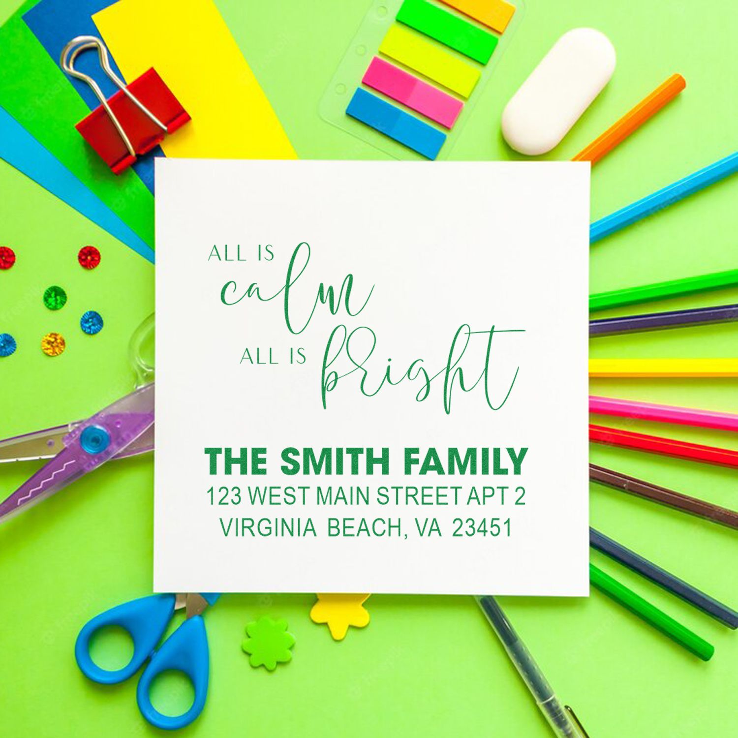 Personalized rubber stamp for holiday envelopes, featuring All is calm, all is bright and the Smith family return address.