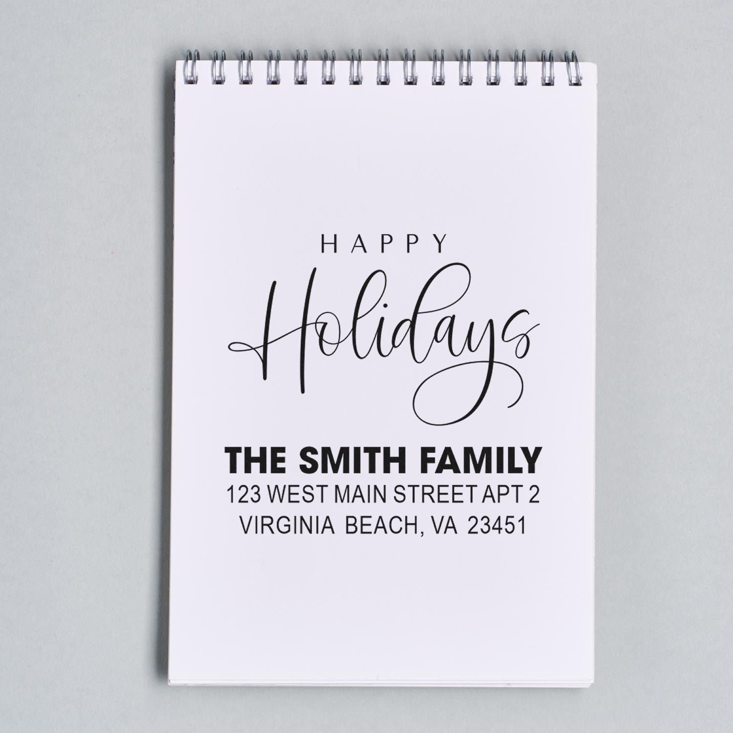 Custom Happy Holidays address rubber stamp for The Smith Family, with name and Virginia Beach return address.