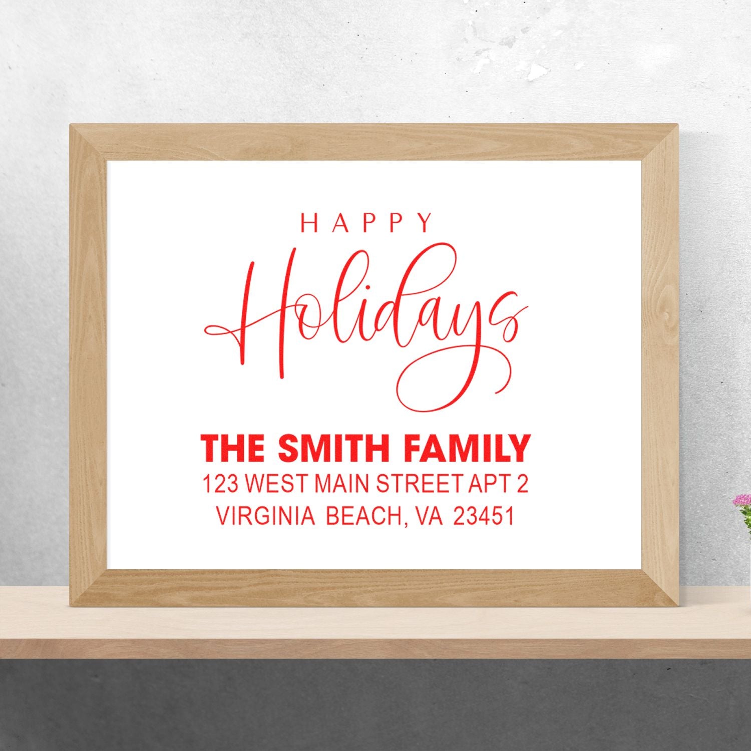 Custom Happy Holidays rubber stamp with family name and address for festive holiday cards and envelopes.