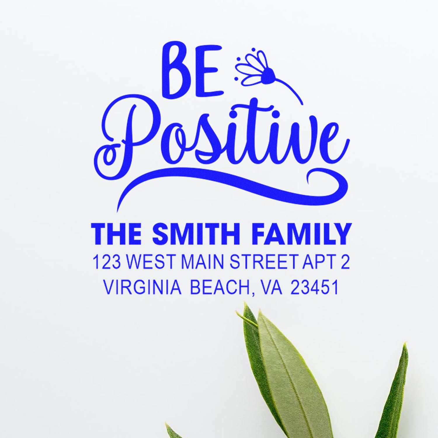 Custom rubber stamp with Be Positive message and The Smith Family return address for mailing.