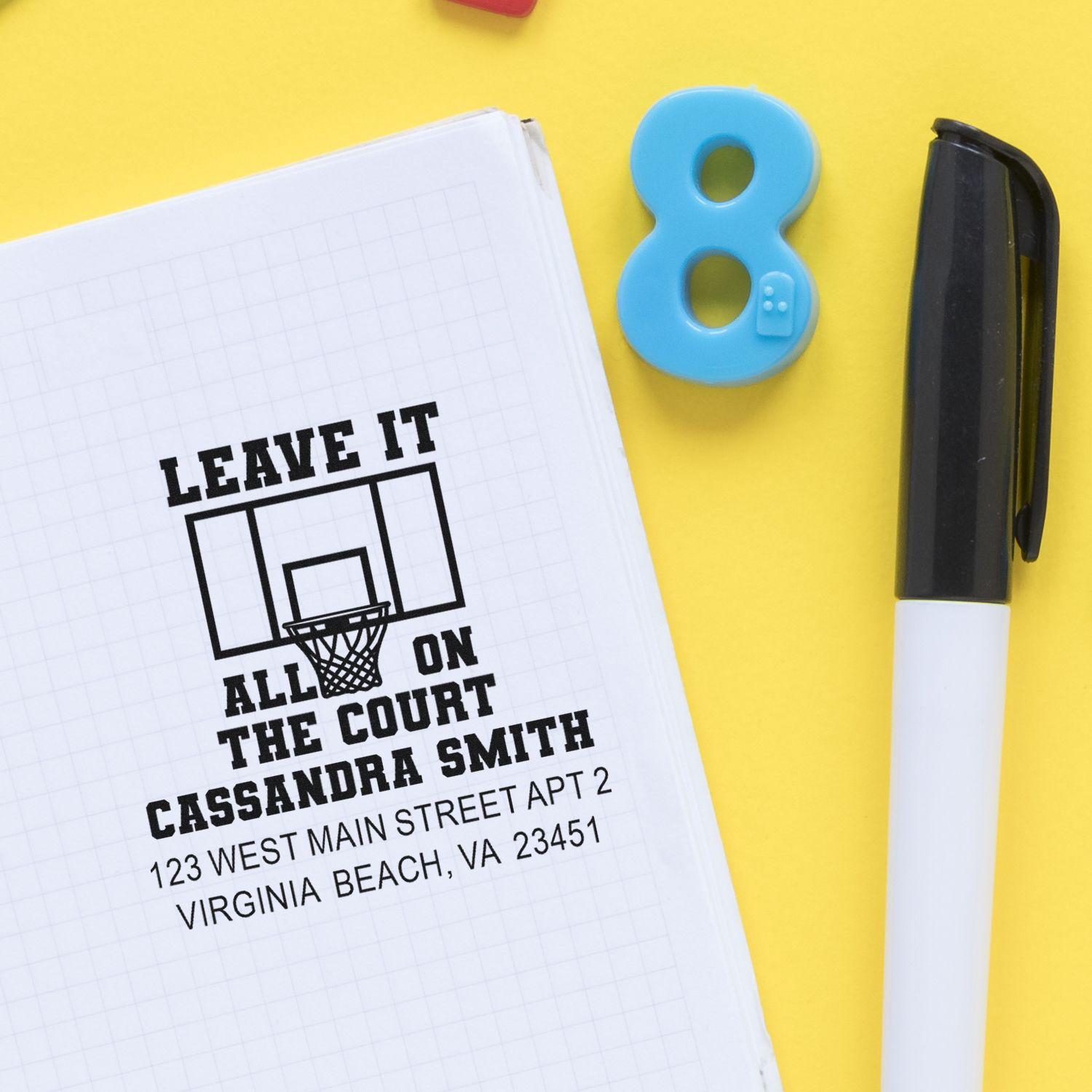 Custom basketball rubber stamp with name and address, featuring Leave It All on the Court slogan on a notebook.