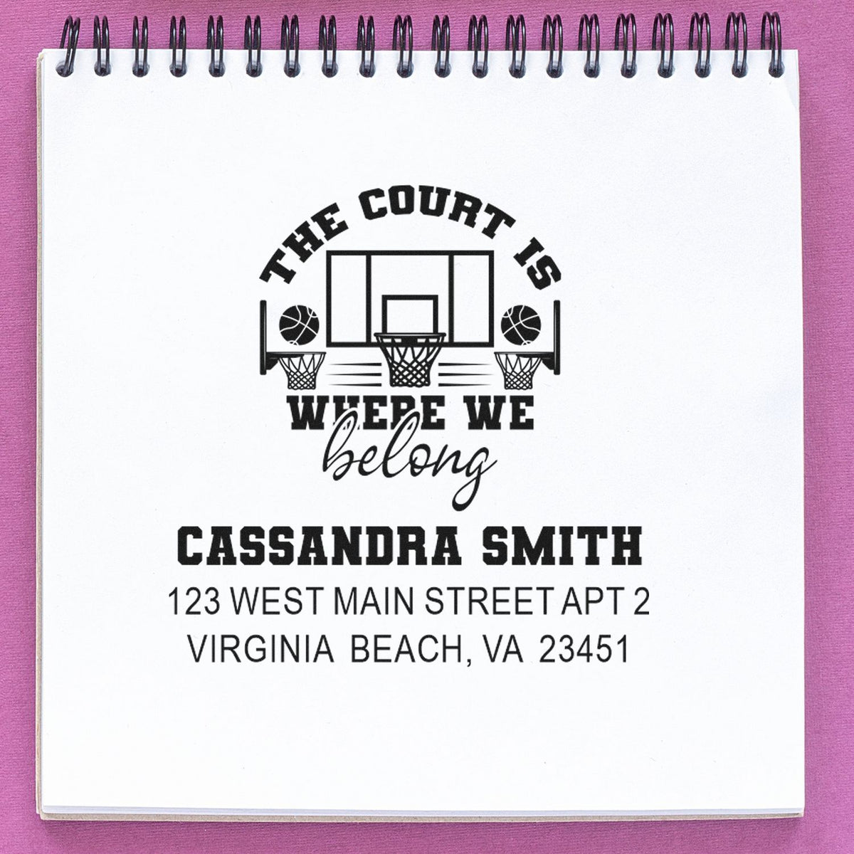 Custom basketball return address rubber stamp with slogan "The court is where we belong" for personalized mailings.