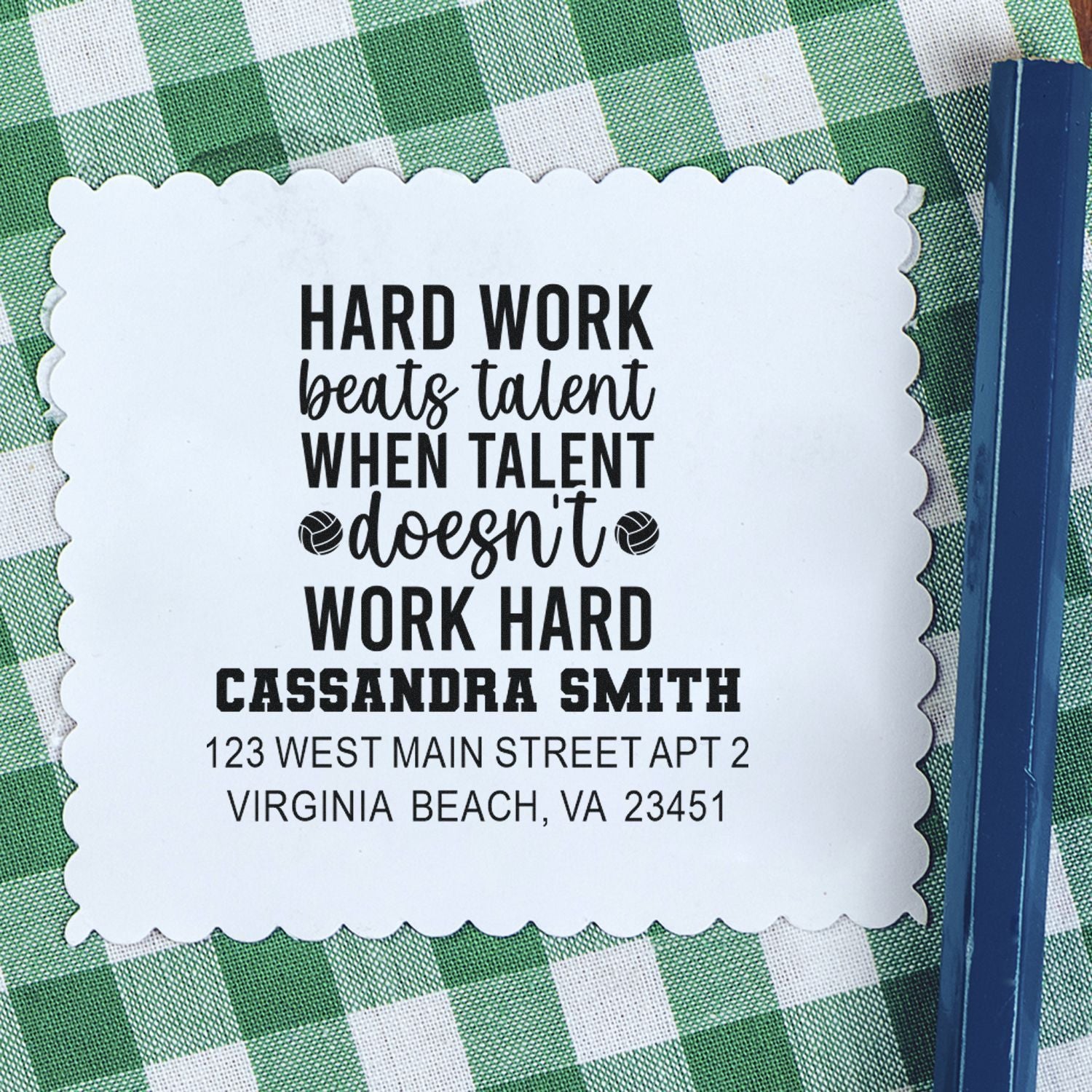Personalized rubber address stamp with quote and return address for Cassandra Smith on scalloped paper.