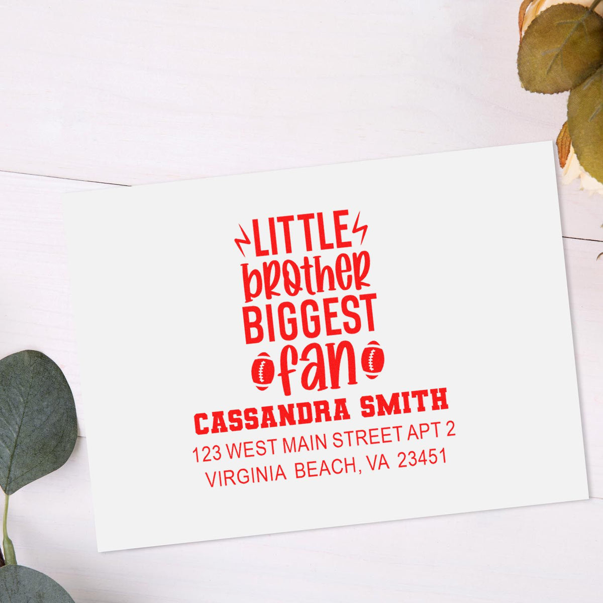 Custom red personalized rubber address stamp for Little Brother Biggest Fan with football icons, name, and Virginia Beach address.