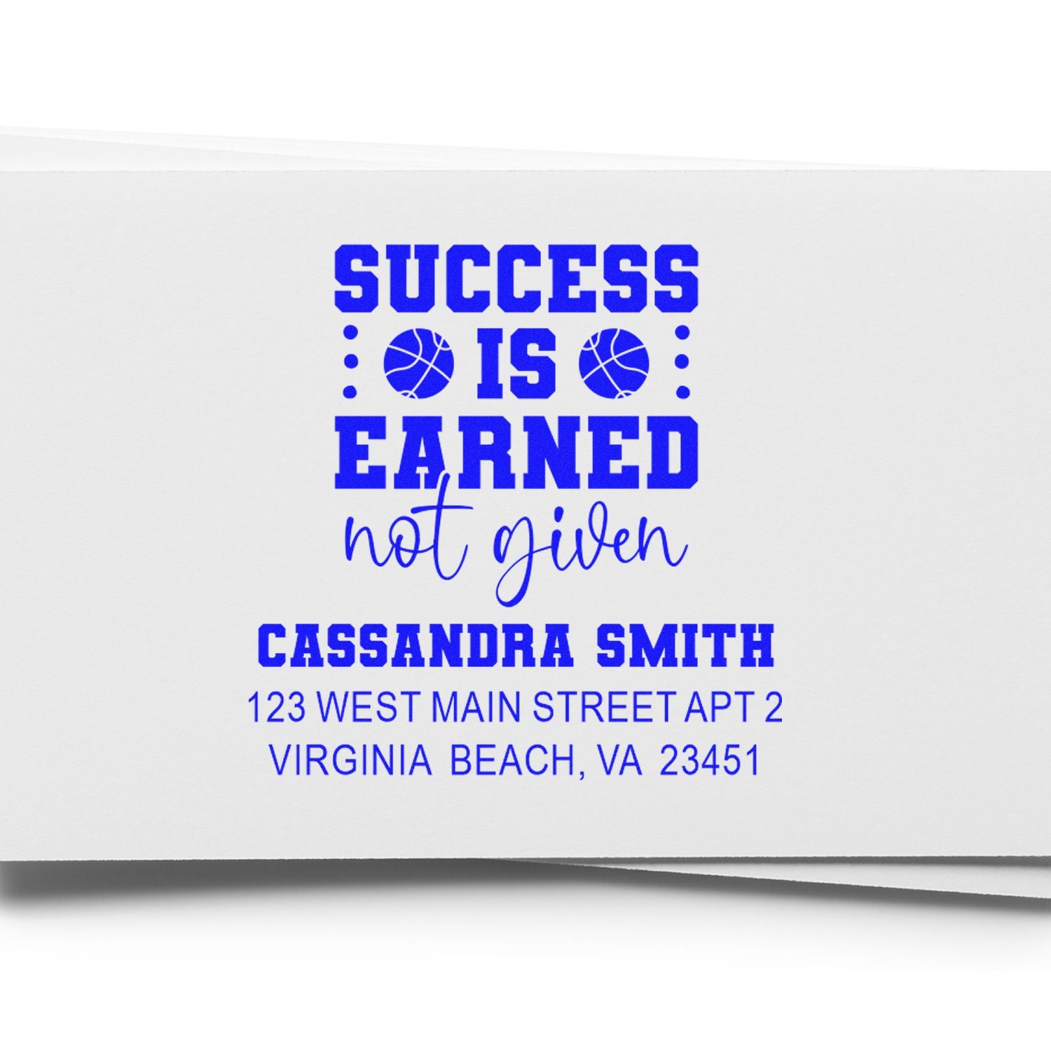 Custom rubber stamp with motivational Success Is Earned, Not Given design and personalized return address for Cassandra Smith.