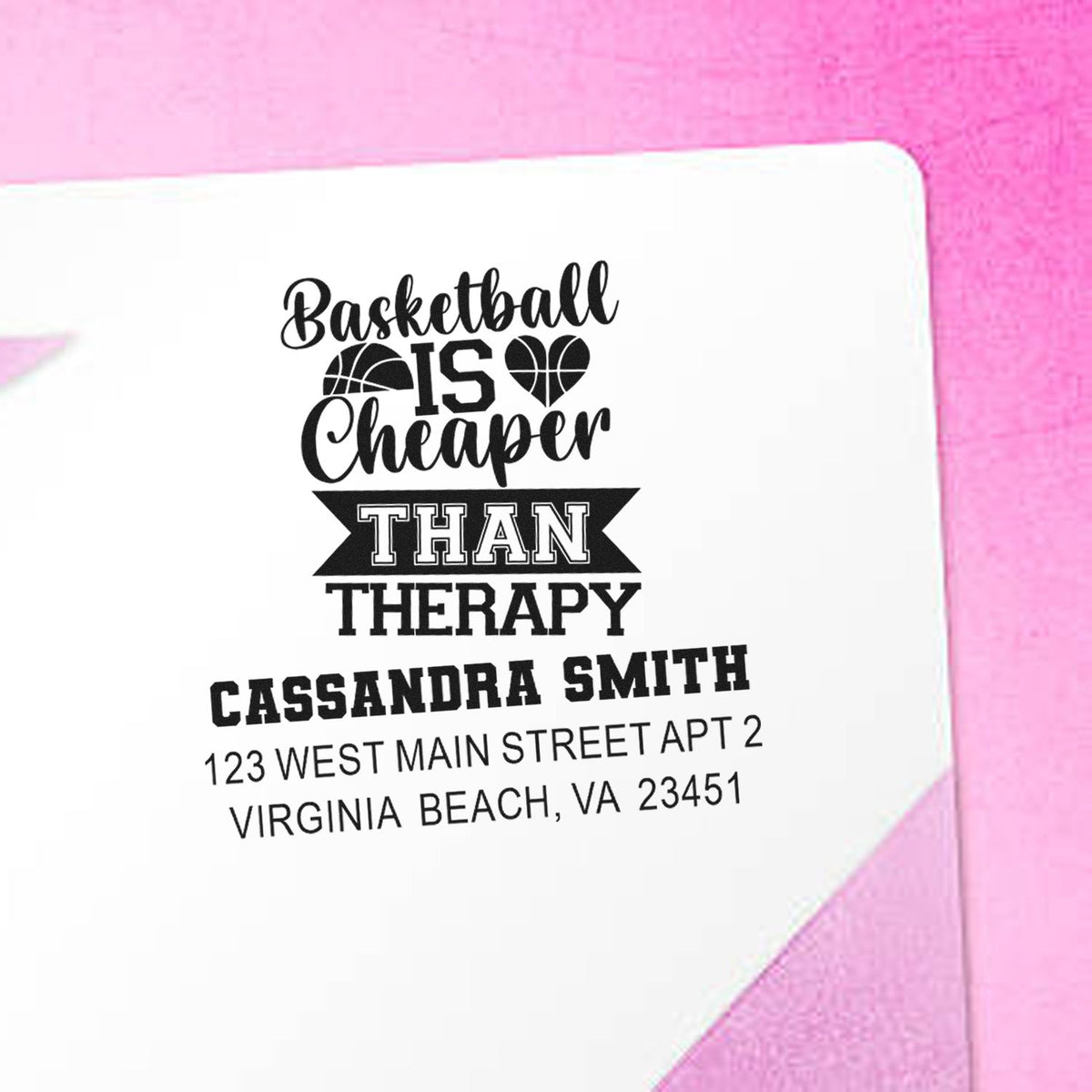 Custom basketball return address rubber stamp on pink envelope with Basketball is cheaper than therapy and contact details.