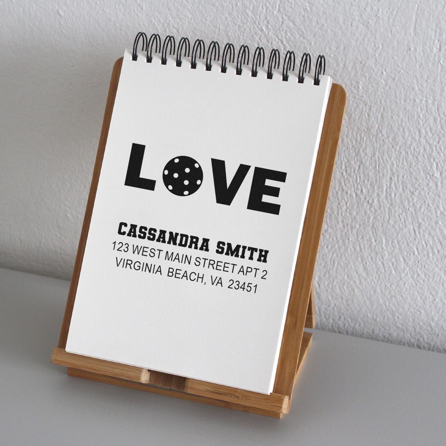 Custom return address rubber stamp with LOVE design for wedding stationery and gift packaging.