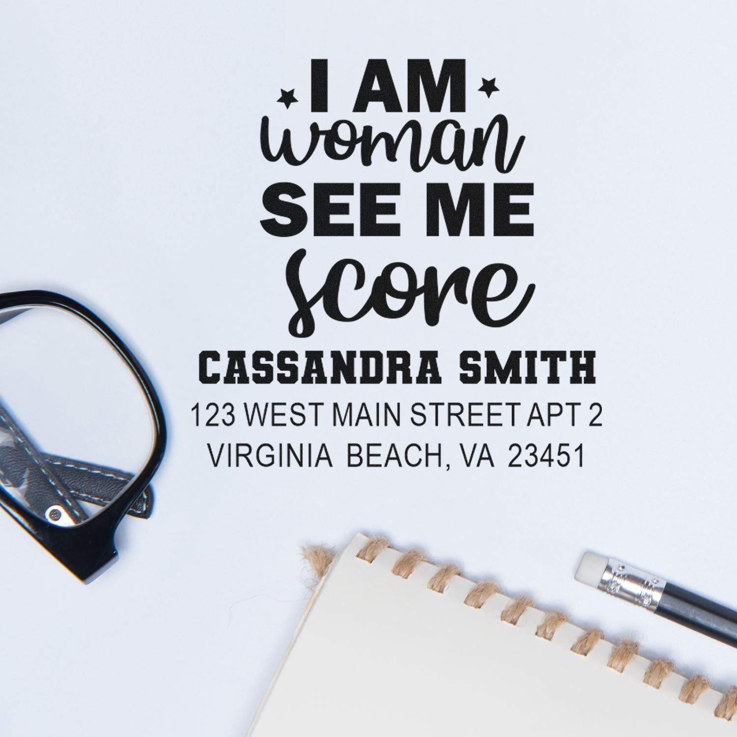 Custom rubber stamp with I Am Woman quote, name, and return address for personalized stationery or business mailings.