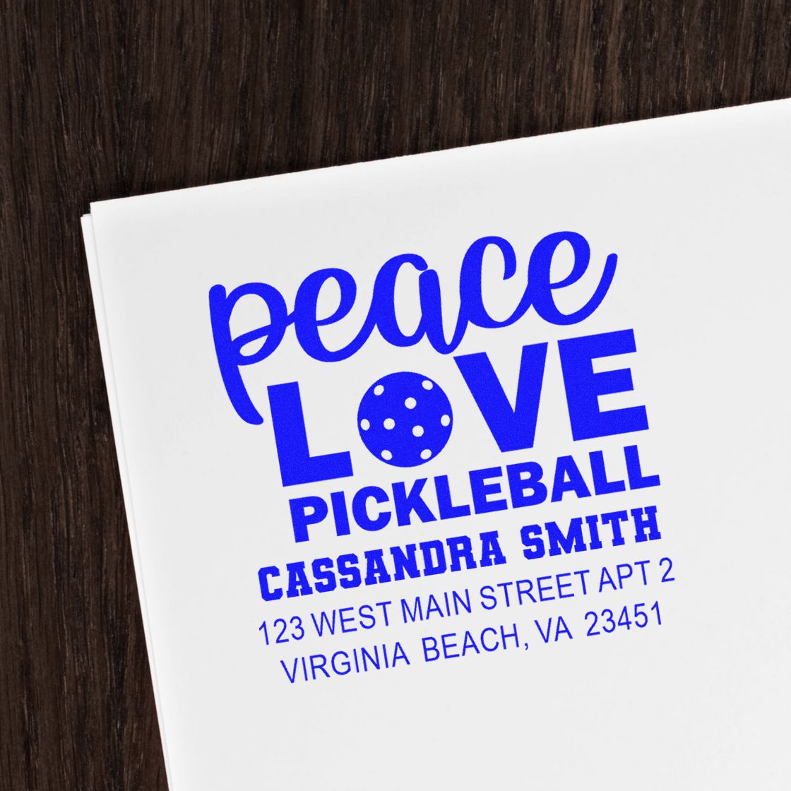 Blue custom rubber stamp impression with Peace Love Pickleball and Cassandra Smith return address for Virginia Beach.