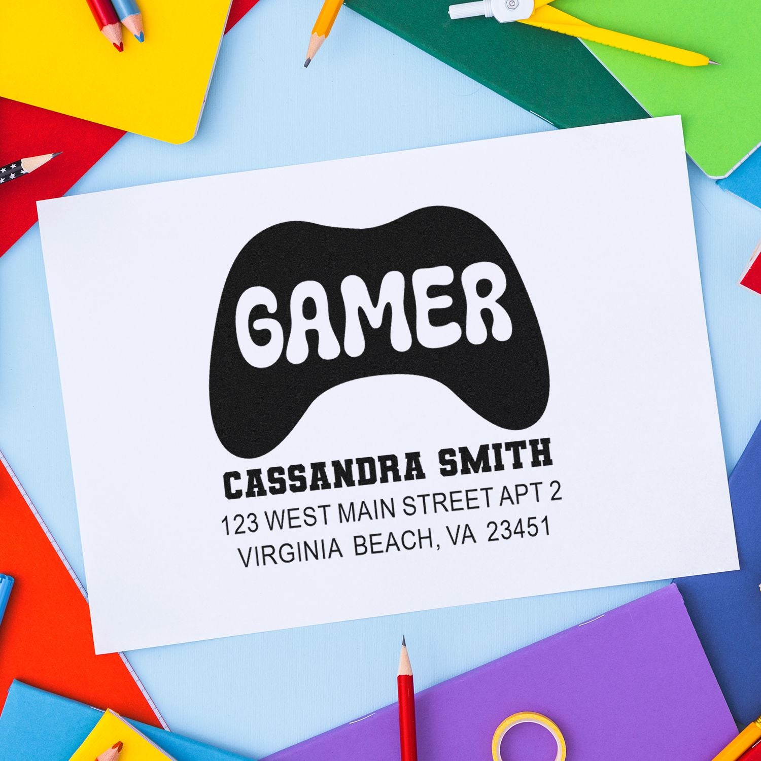 Personalized gamer address rubber stamp with controller graphic, name, and mailing address for custom stationery.