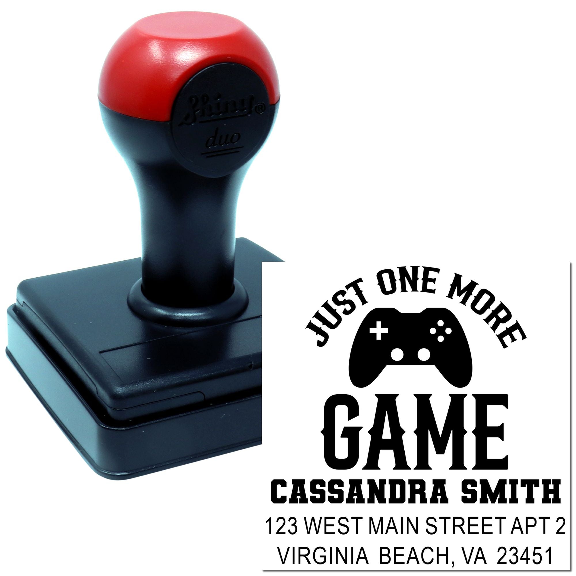 Custom gamer rubber stamp with Just One More Game controller design, name, and address for personalized self-inking stamping.