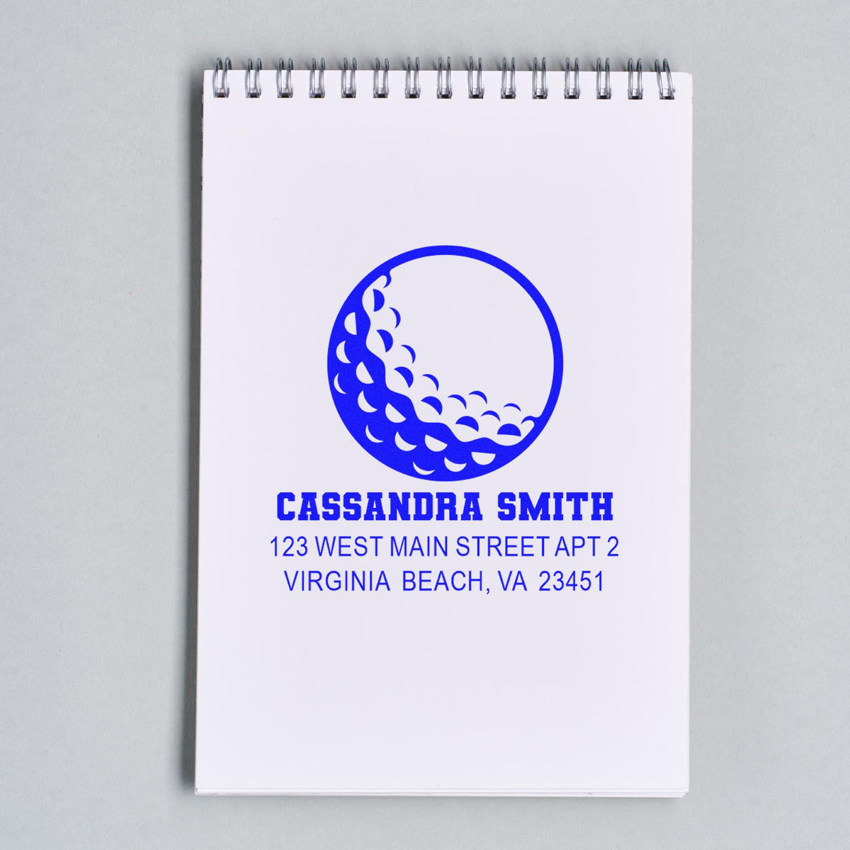 Custom return address rubber stamp for Cassandra Smith, Virginia Beach, VA, with circular wave logo.