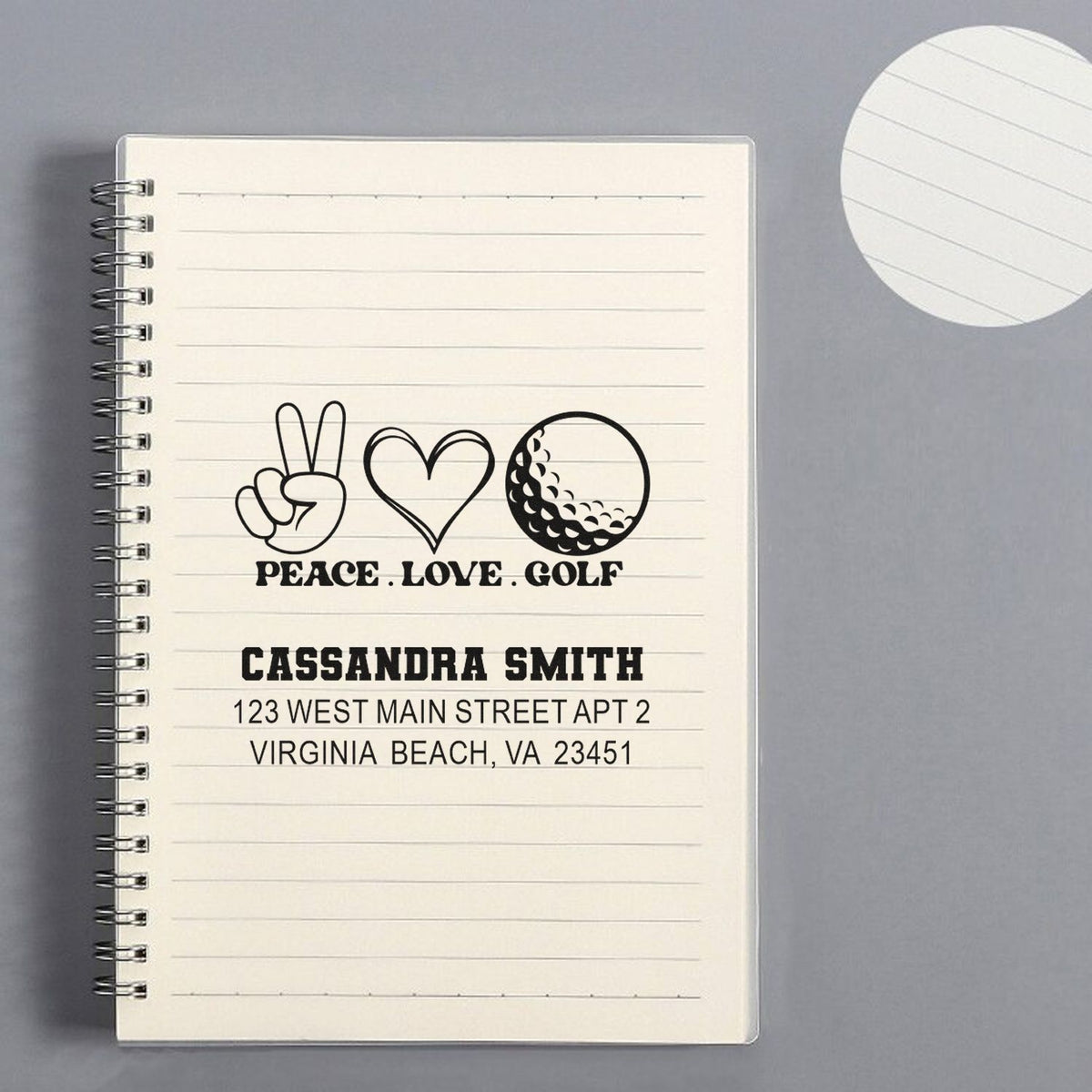 Personalized golf rubber stamp with peace love golf design, name, and return address on notebook page