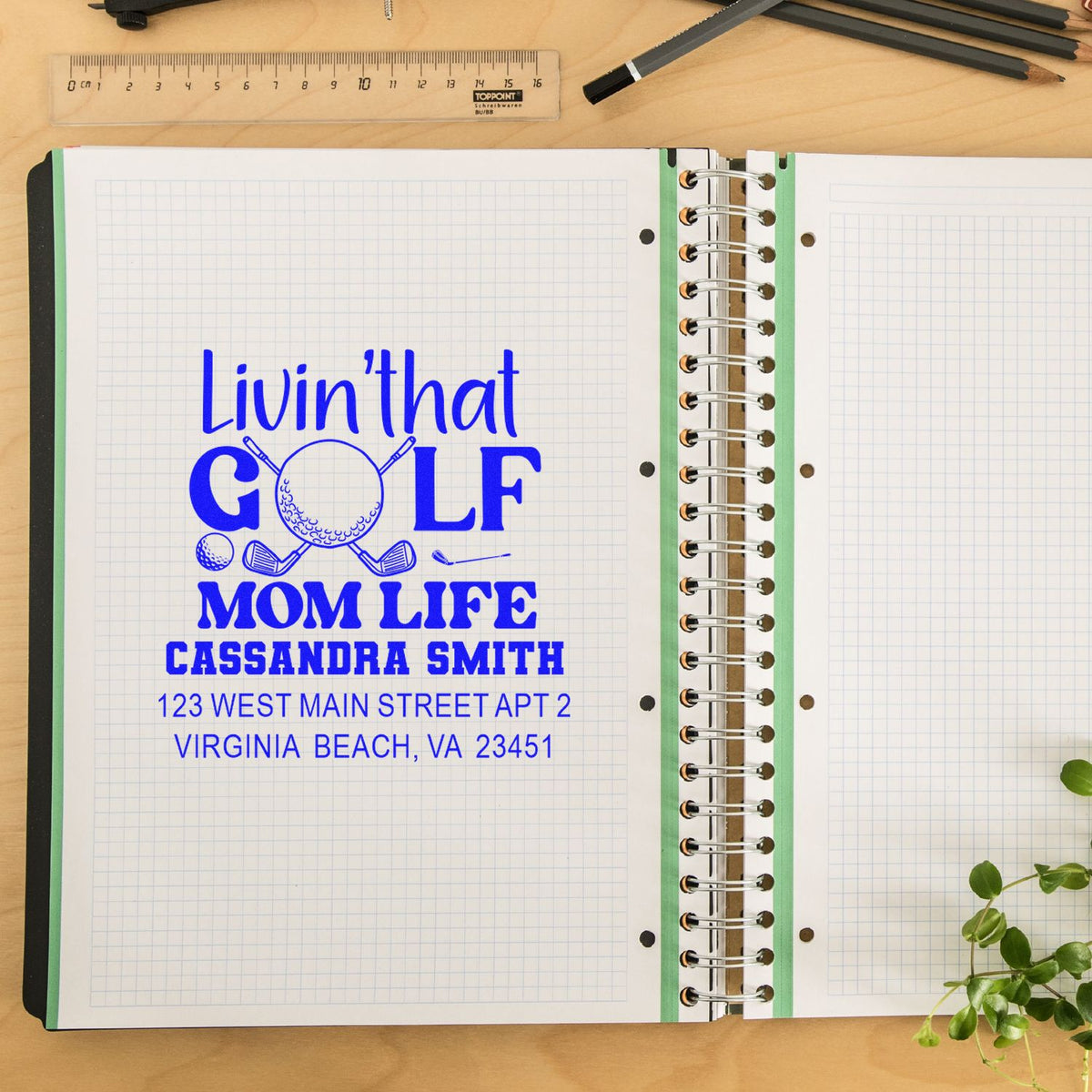 Custom rubber stamp impression for a golf mom, featuring personalized name and address on a notebook page.