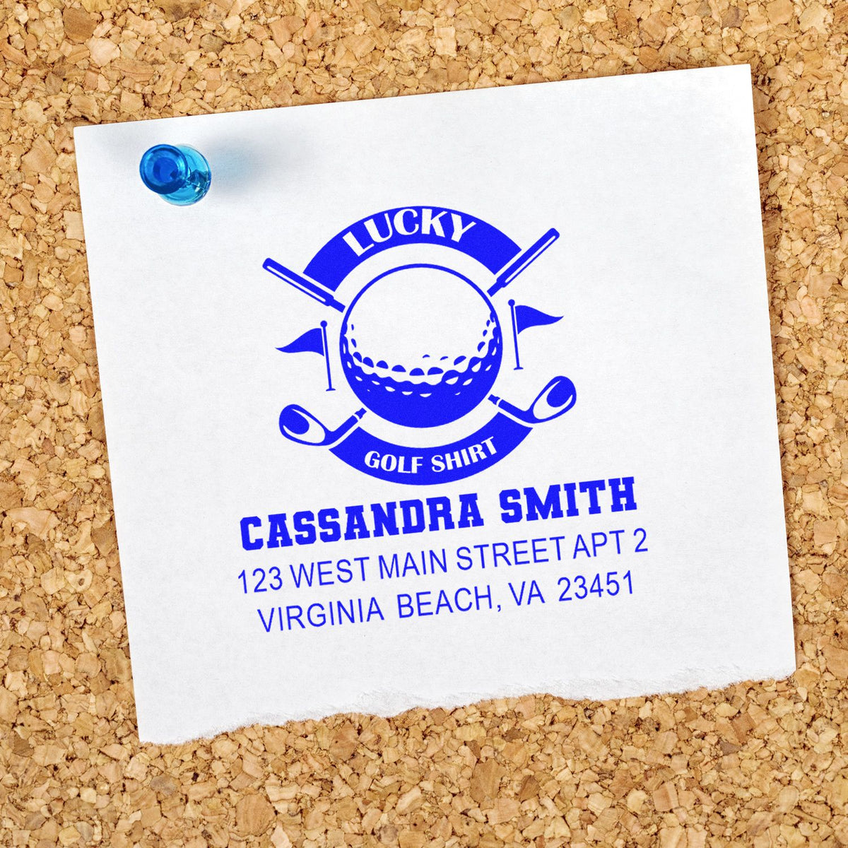 Golf-themed custom rubber stamp with name and address, featuring a blue Lucky Golf Shirt design on pinned paper.