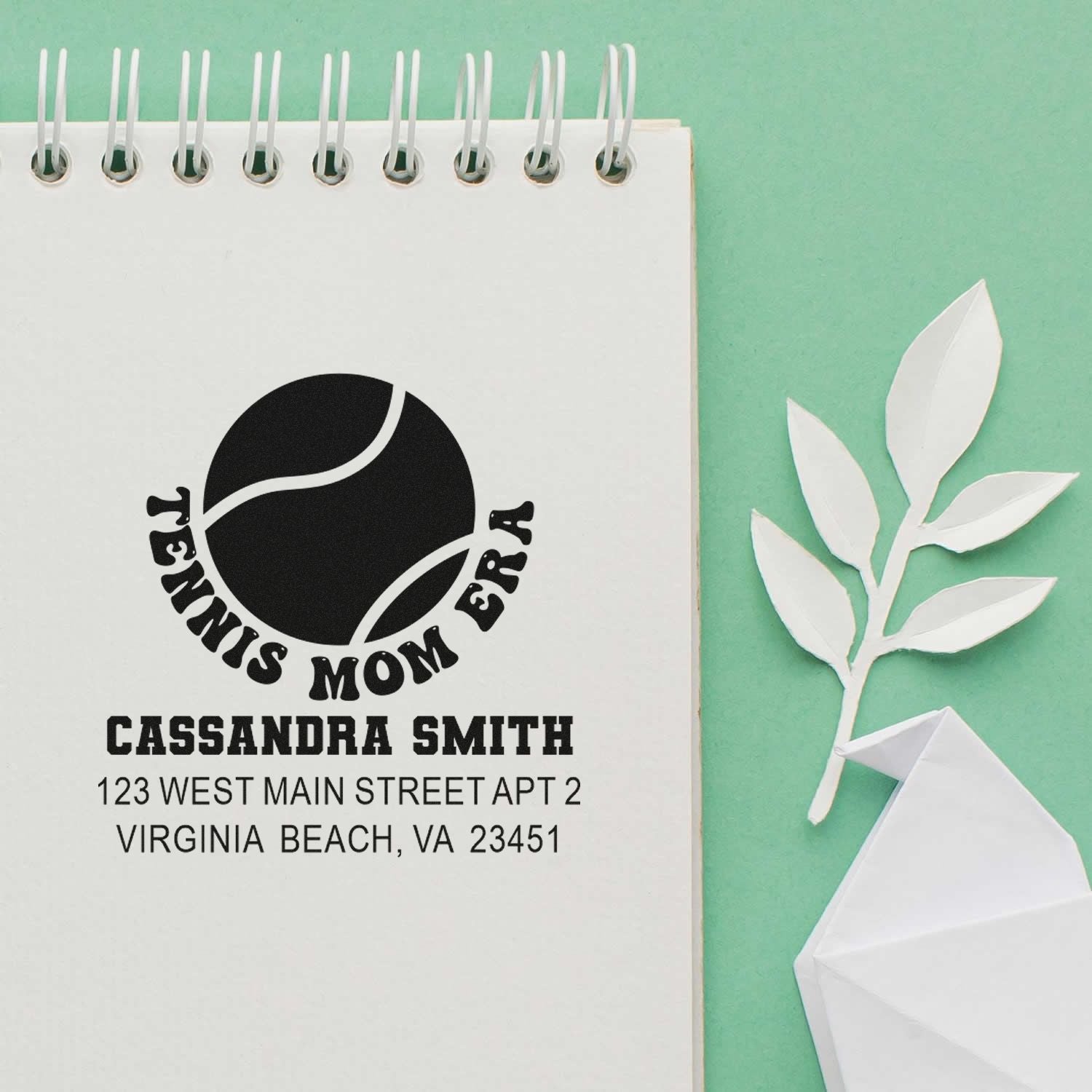 Personalized rubber stamp with tennis mom logo, Cassandra Smith name, and return address for custom mailing.