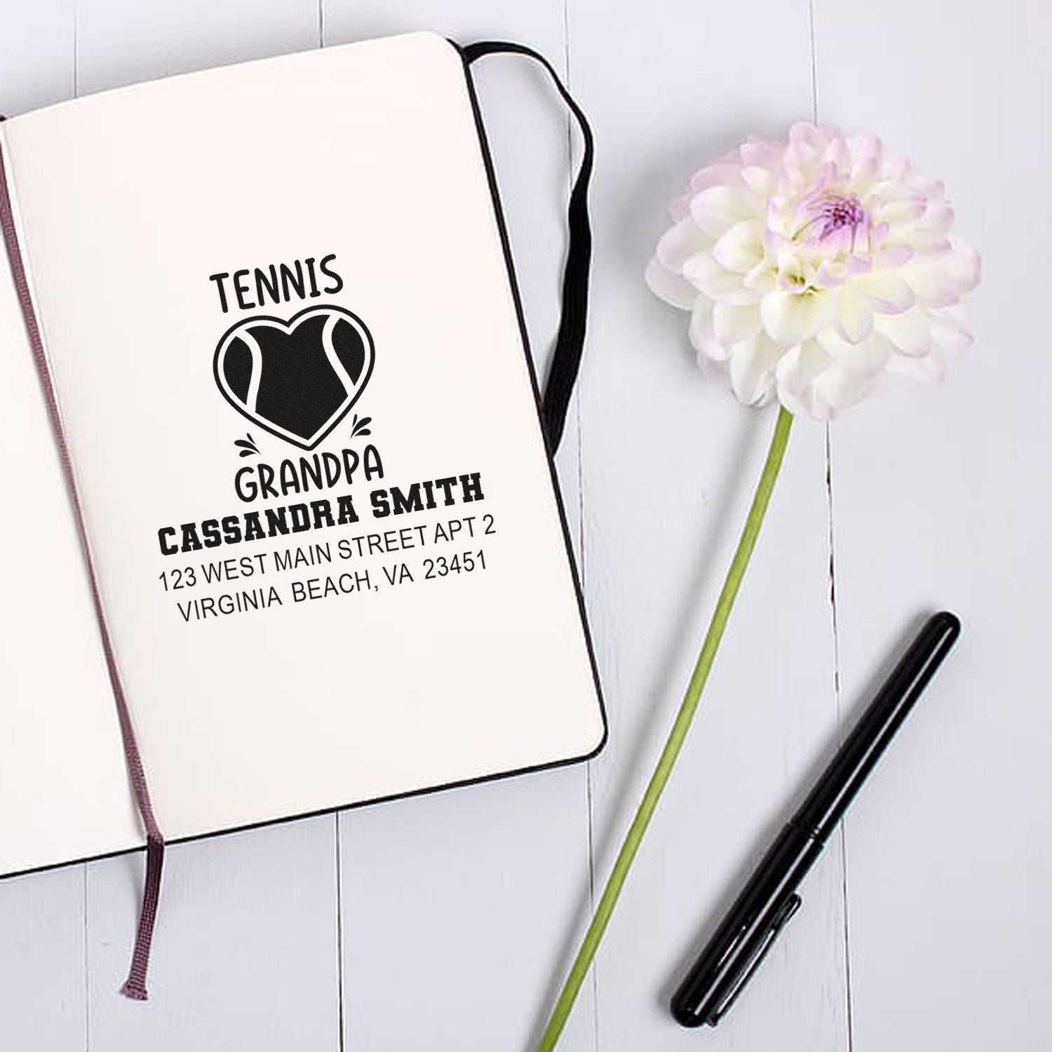 Custom tennis grandpa address rubber stamp on notebook mockup with personalized name and address.