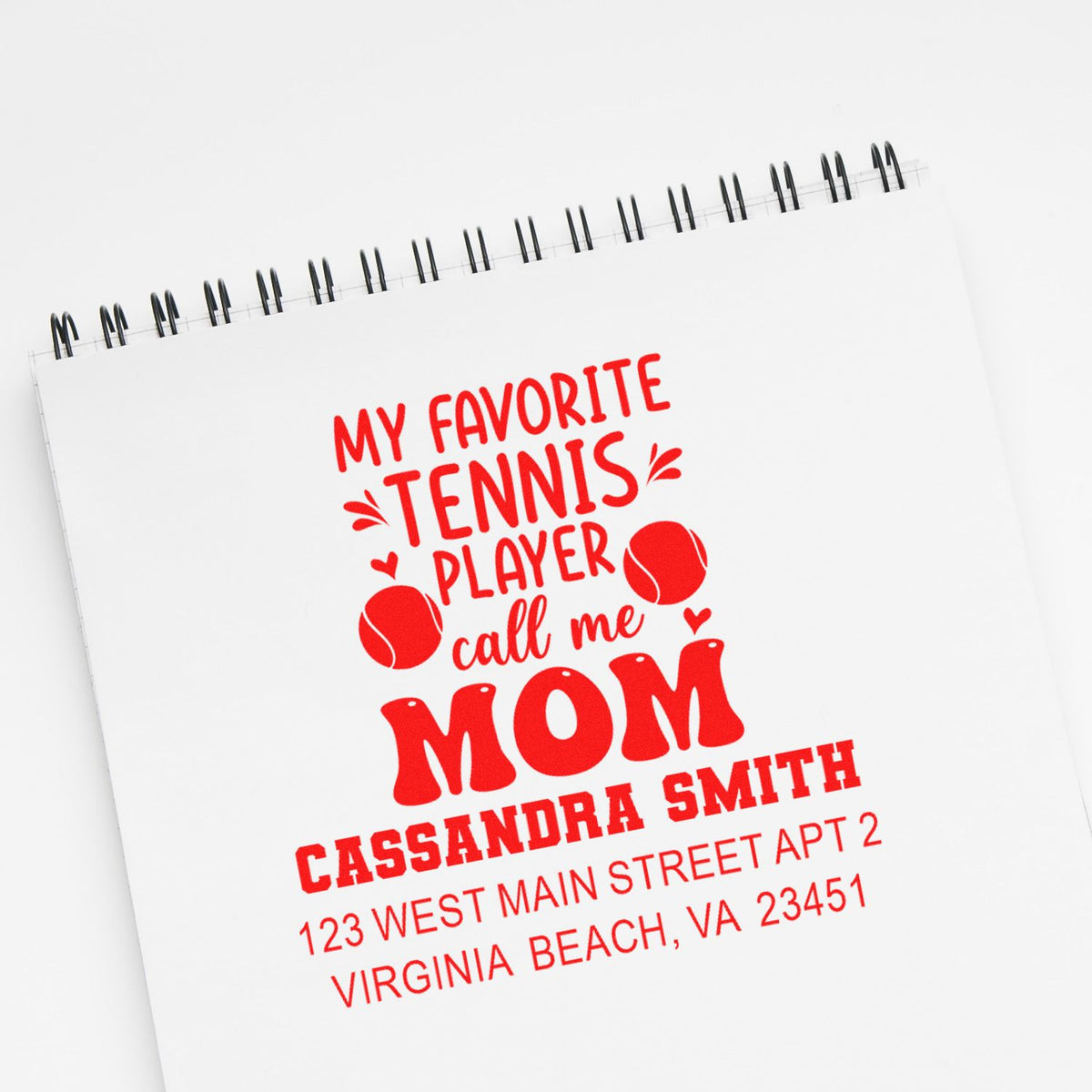 Custom tennis mom rubber stamp with name and address for personalized stationery and gift packaging.