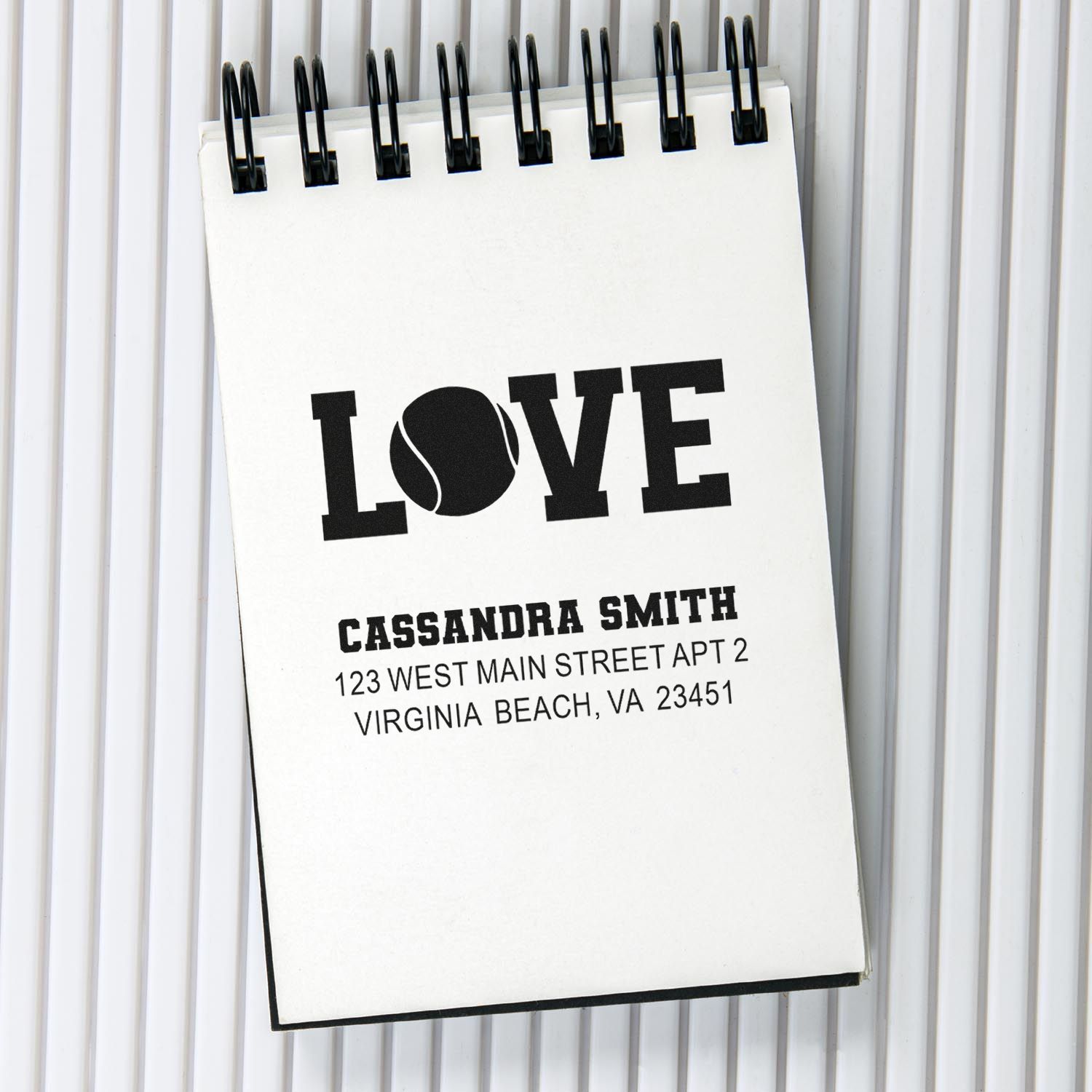 Custom address stamp design mockup with LOVE and name/address details for personalized wedding or mailing stationery.