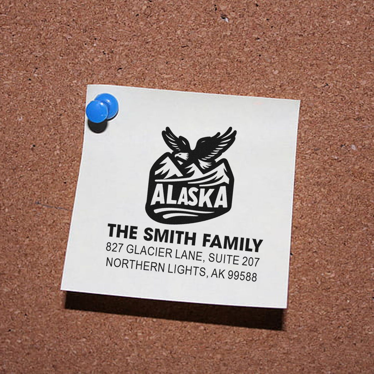 Custom Alaska family address rubber stamp design with eagle logo, The Smith Family, and Northern Lights, AK address.