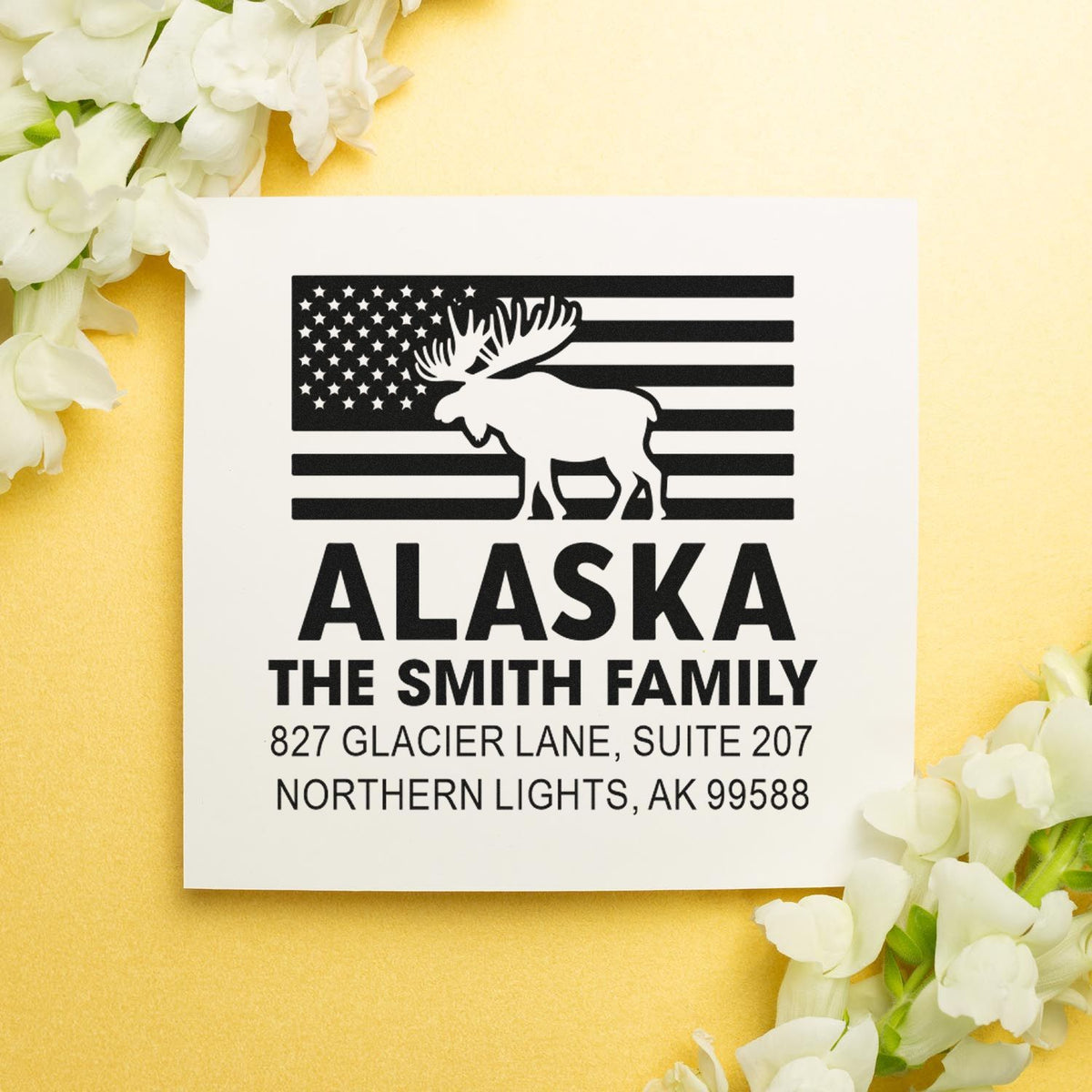 Custom Alaska family address rubber stamp with moose flag design, The Smith Family name, and Northern Lights, AK return address.