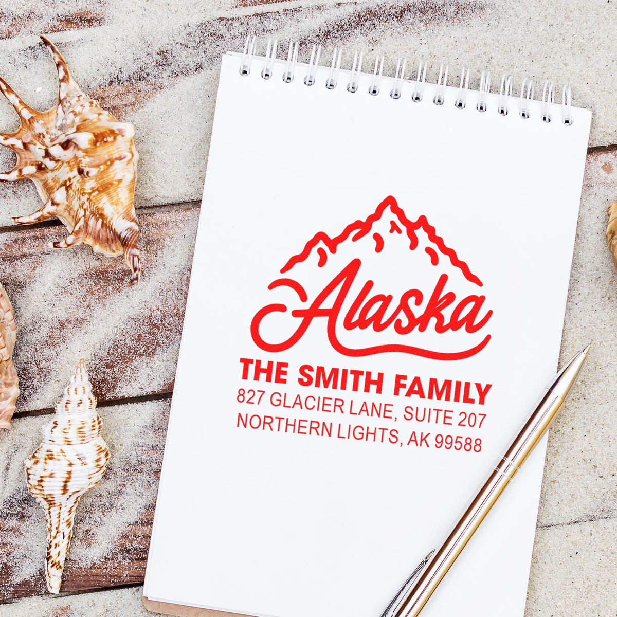 Personalized Alaska address rubber stamp for The Smith Family with mountain logo, Northern Lights, AK 99588.