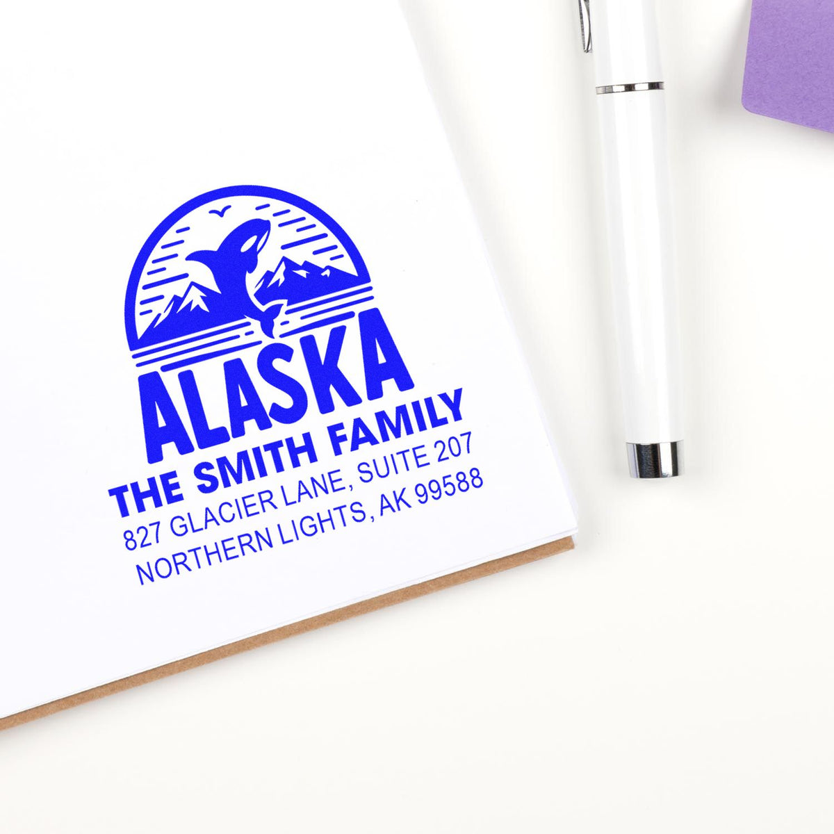Custom Alaska family return address stamp with whale and mountains for personalized envelopes and mailing.
