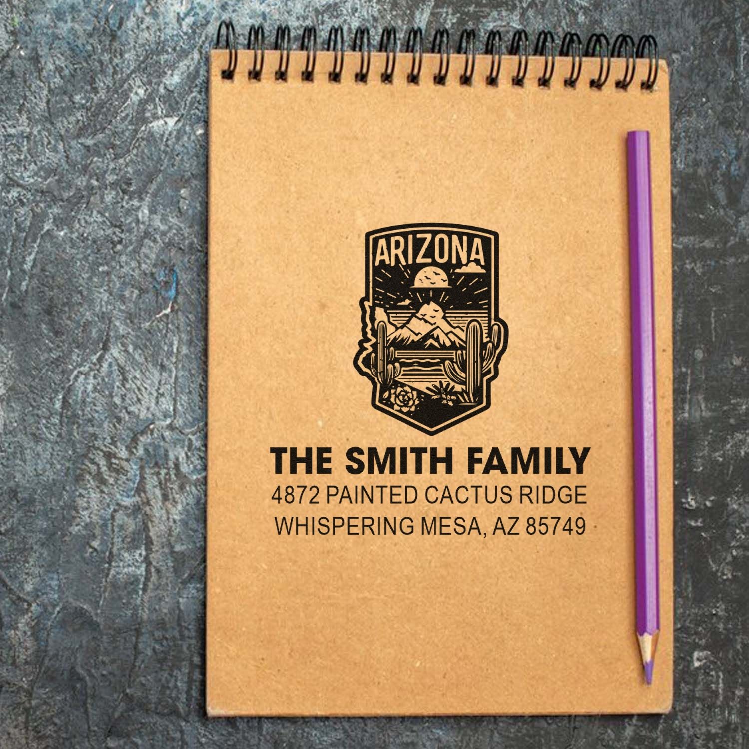 Custom Arizona family address rubber stamp on notebook, featuring The Smith Family and Whispering Mesa address.