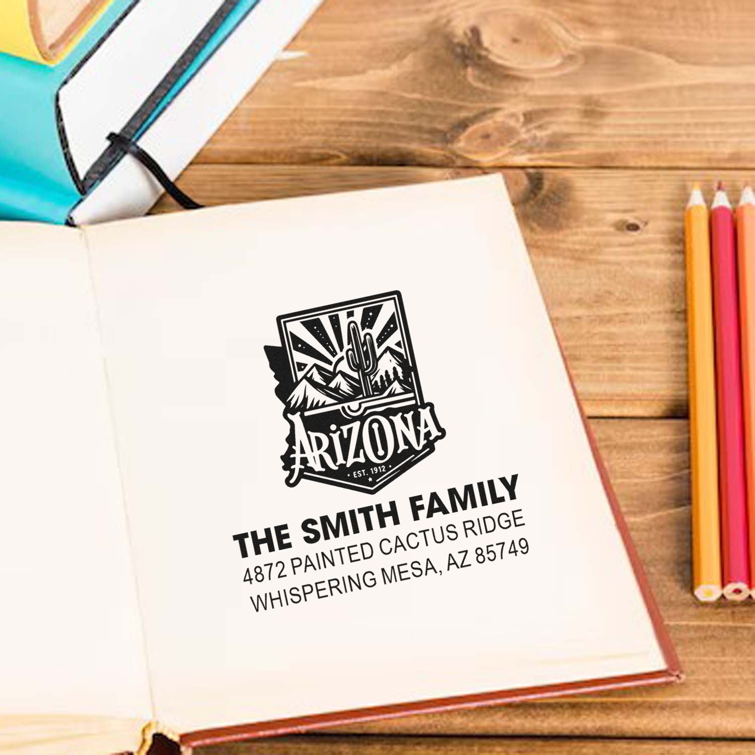 Custom Arizona family address rubber stamp on notebook with cactus logo and personalized mailing address.