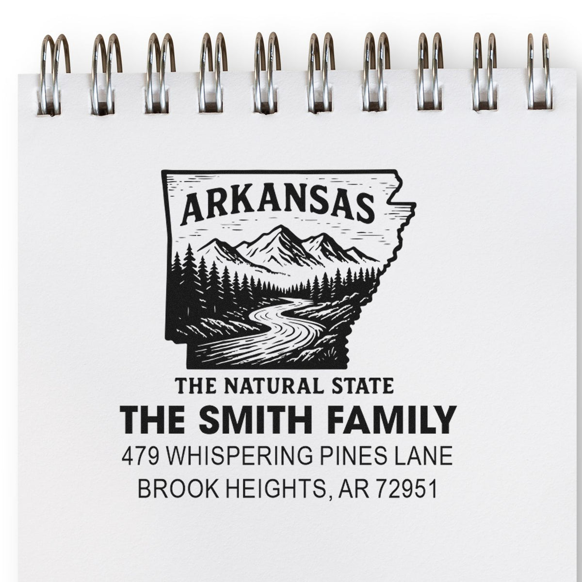 Custom Arkansas return address rubber stamp with family name, street address, and scenic state logo for personalized mail.