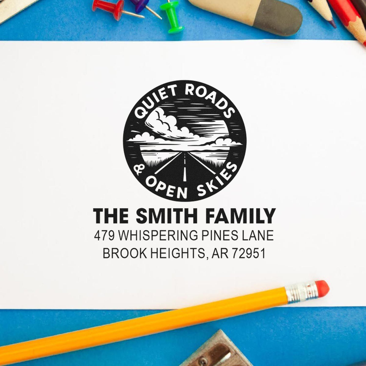 Custom rubber return address stamp with Quiet Roads & Open Skies logo for The Smith Family, Brook Heights, AR.