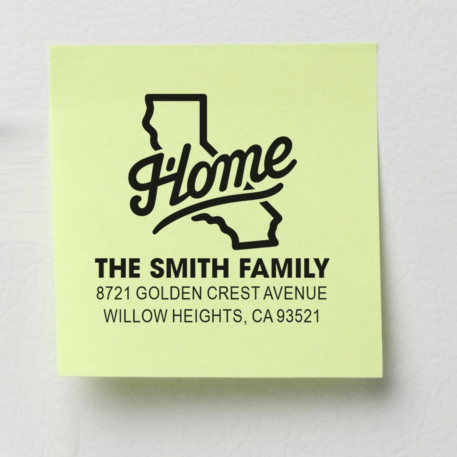 Custom home address rubber stamp with California outline, family name, street address, and city for mailings.