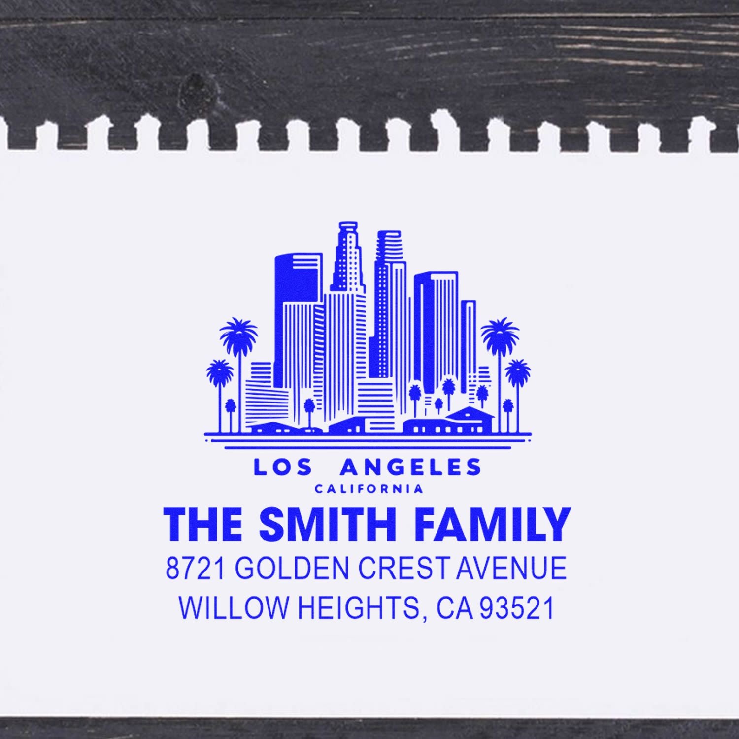 Los Angeles skyline custom rubber address stamp for The Smith Family with Willow Heights, CA return address in blue ink.