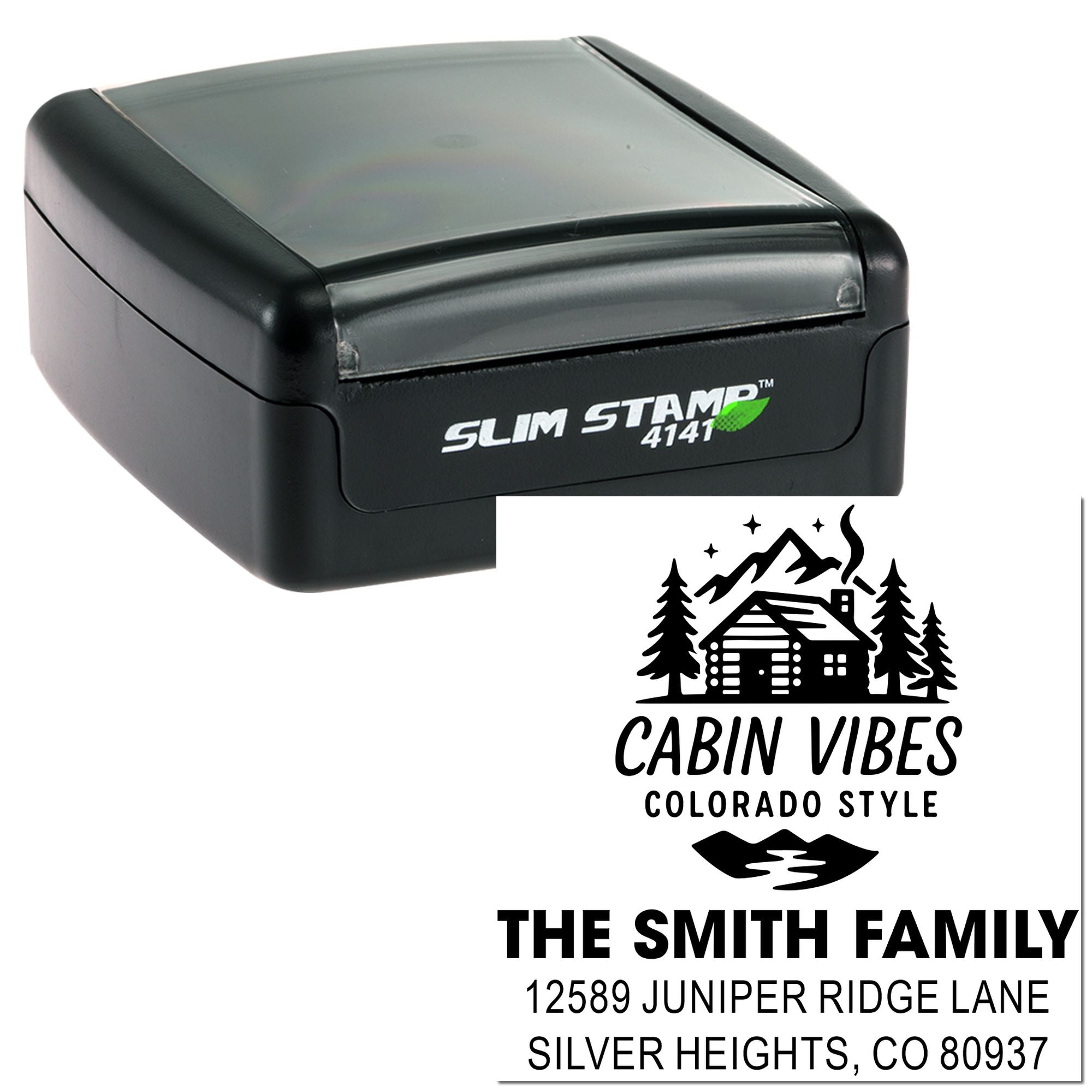 Slim self-inking custom address stamp with cabin vibes logo, family name, and Colorado return address.