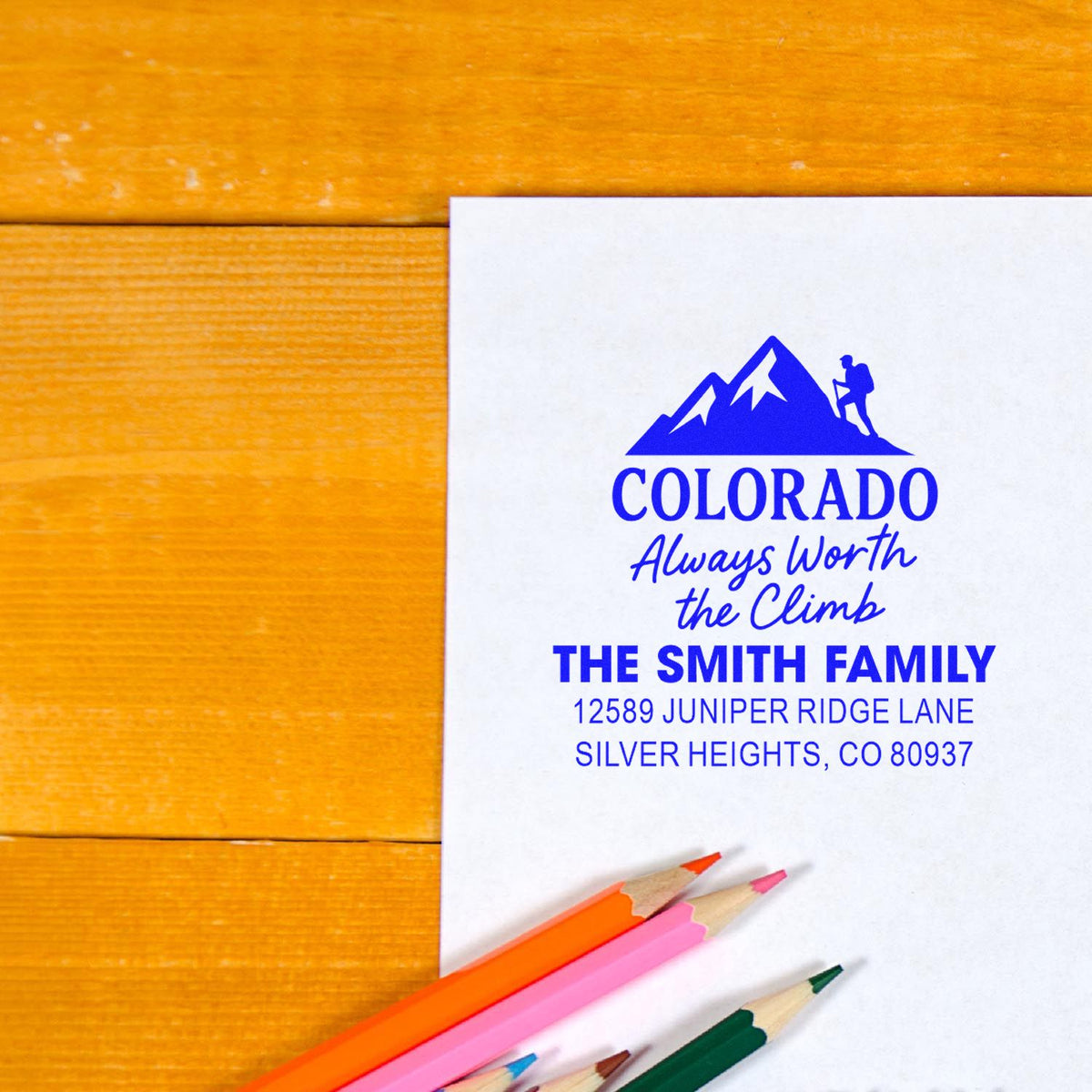 Personalized family return address rubber stamp with Colorado mountain logo and custom mailing details.