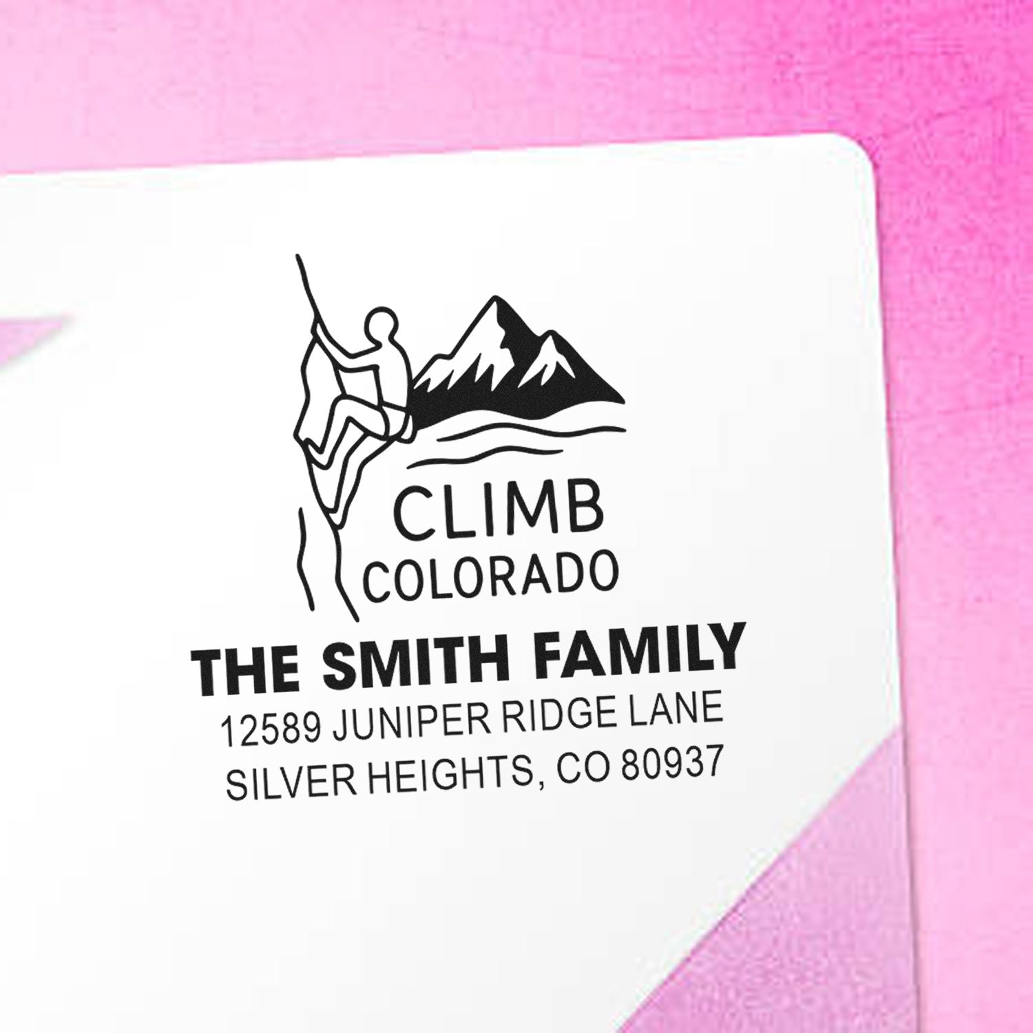 Custom return address rubber stamp with mountain climber design for The Smith Family, Silver Heights, CO.
