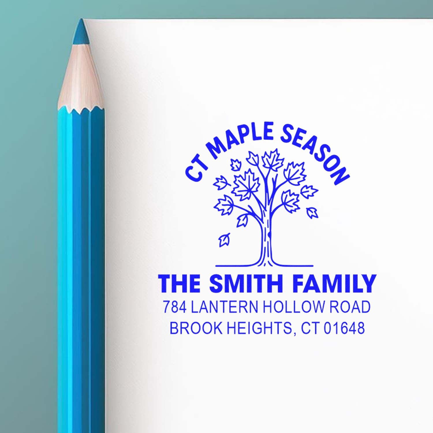 Custom family return address rubber stamp with maple season tree logo and Brook Heights, CT address.