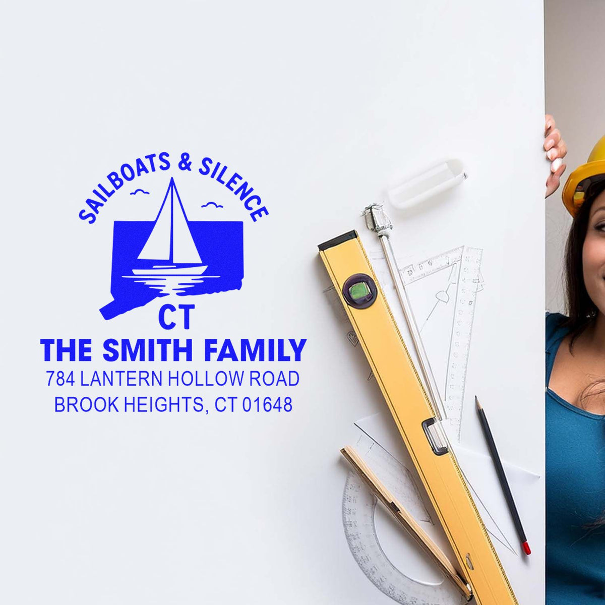 Custom rubber address stamp for The Smith Family, Brook Heights CT, featuring a sailboat logo and return address design.
