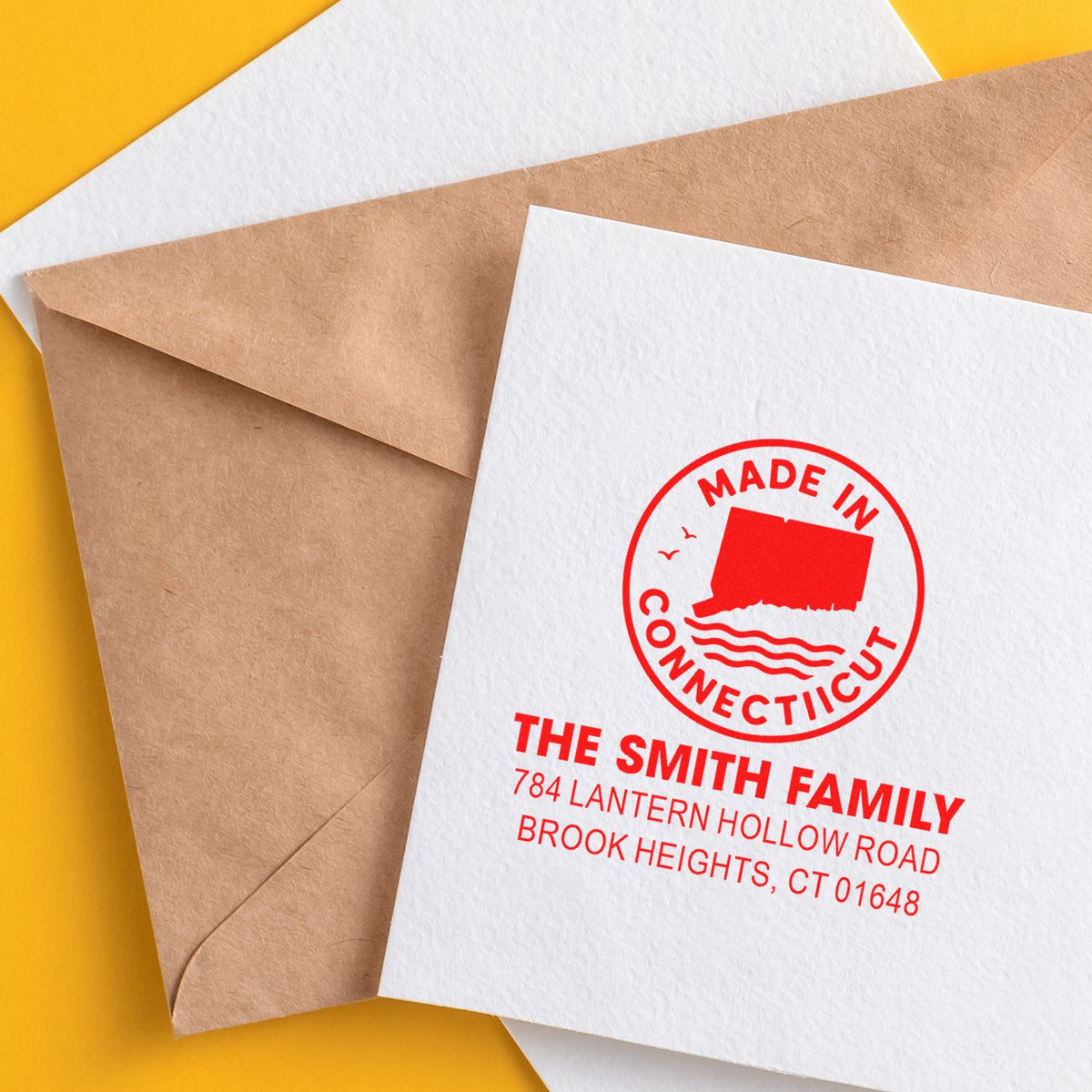 Custom rubber stamp return address on a white envelope, featuring a Made in Connecticut design for The Smith Family.