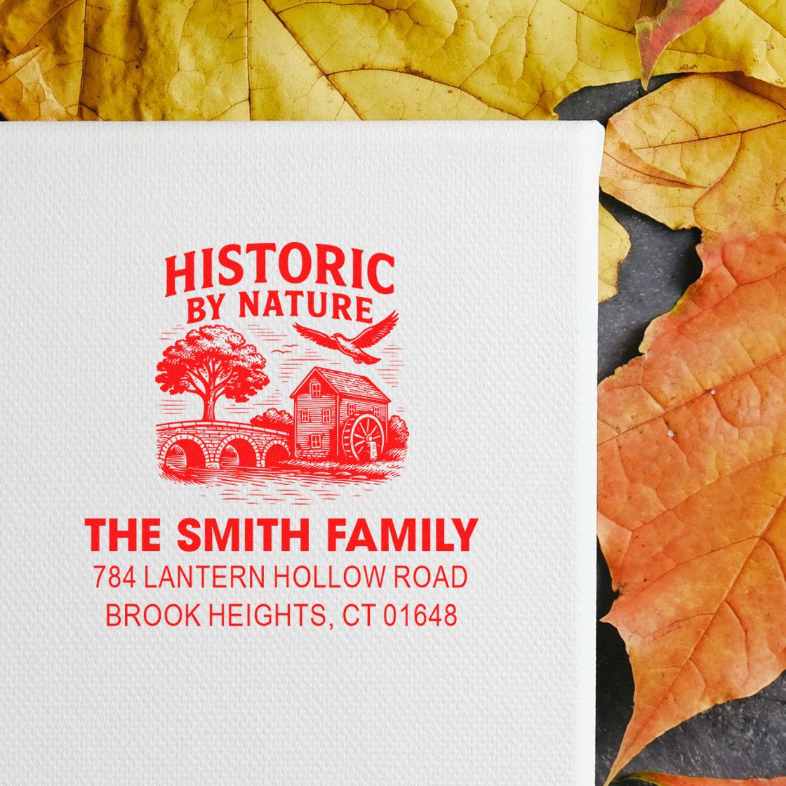 Custom family return address rubber stamp with historic house design, The Smith Family, in red ink.