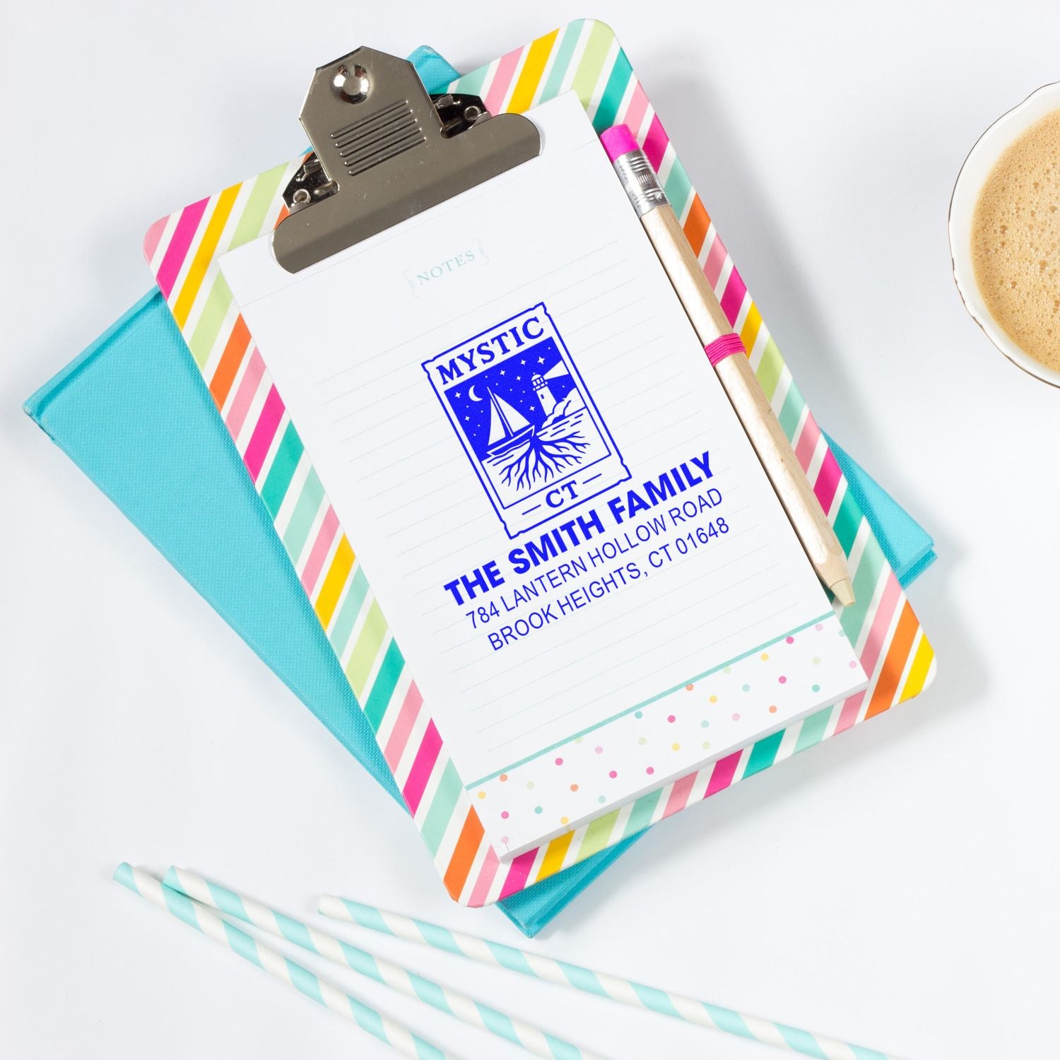 Custom rubber stamp return address imprint on notepad, personalized family address stamp with Mystic CT logo.