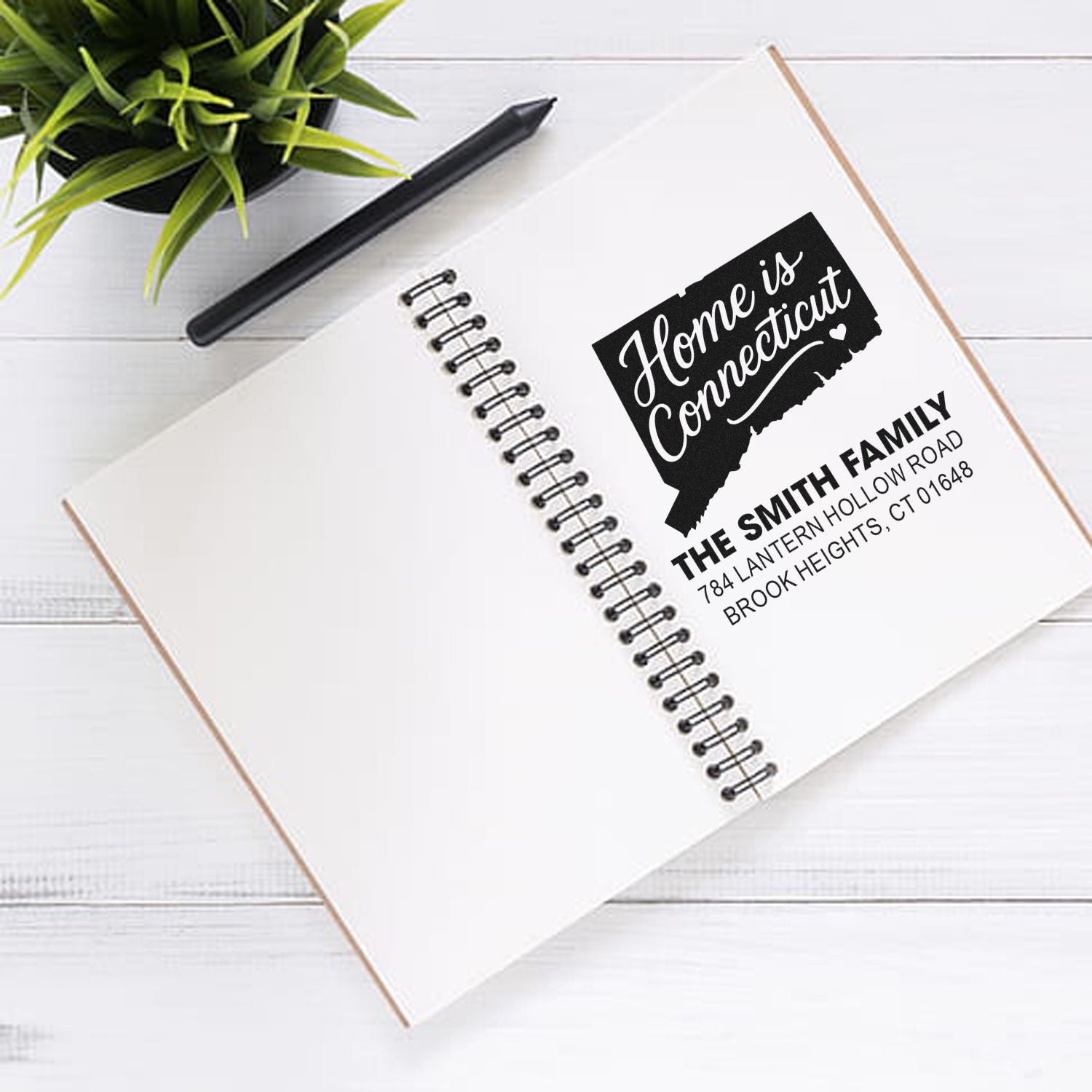 Custom address rubber stamp with Home is Connecticut design for personalized family stationery and mail.