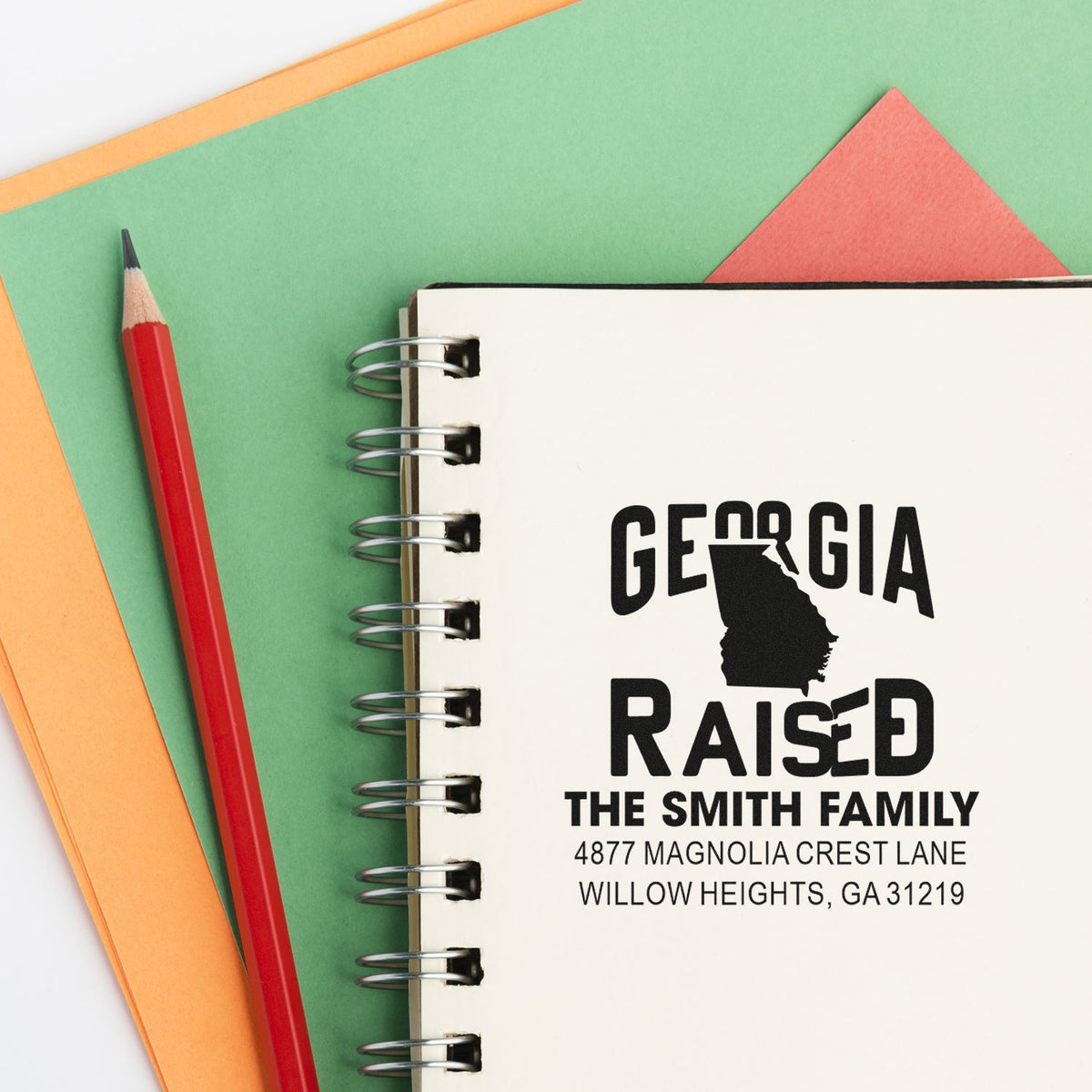 Custom Georgia raised address rubber stamp design on notebook, ideal for personalized family mail, crafts, and branding.