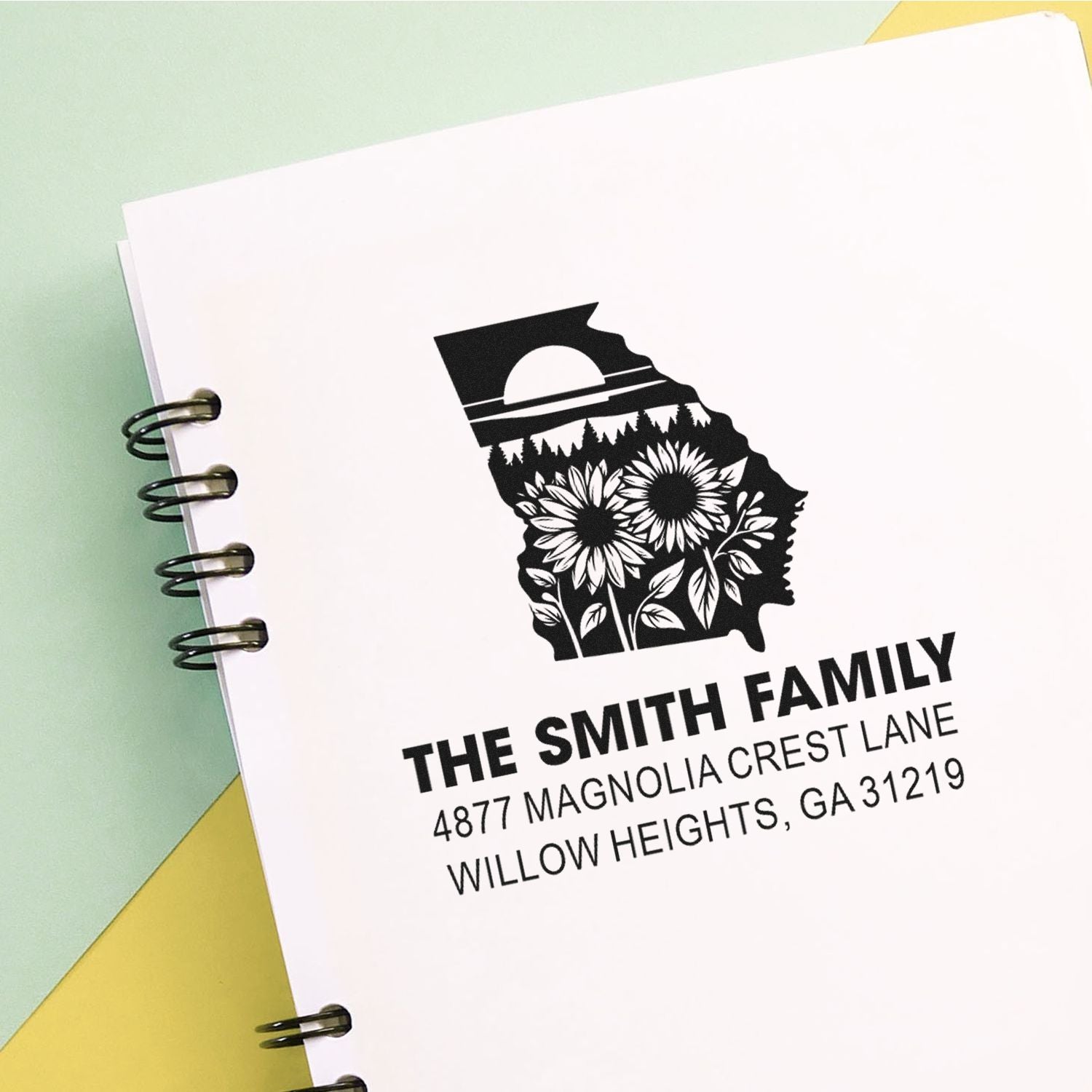 Custom family return address rubber stamp with floral state silhouette design and personalized mailing address.