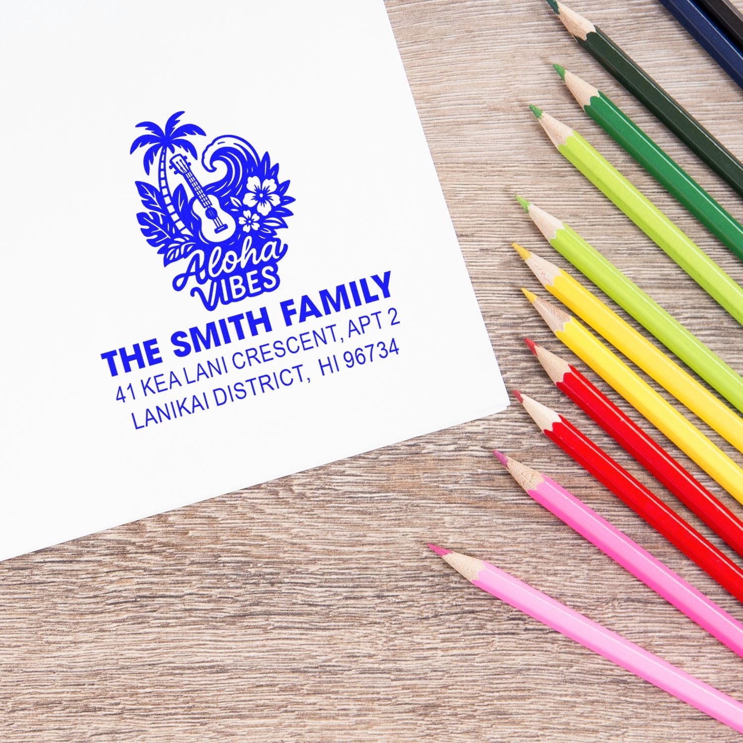 Custom tropical return address rubber stamp with Aloha design for The Smith Family, stamped in blue ink.