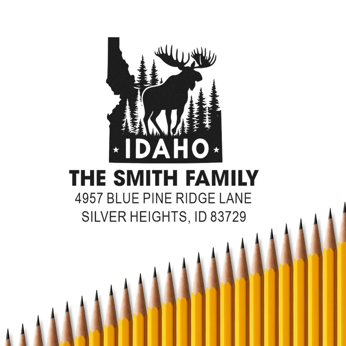 Custom Idaho return address rubber stamp with moose, pine trees, family name, and address.